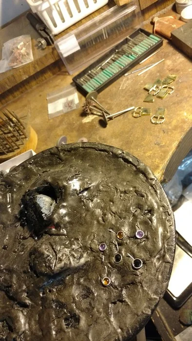 Then I smoosh the studs into the warm pitch