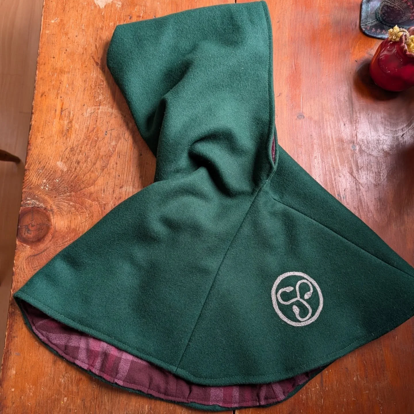 During the holiday season I had an order for a medieval style hood for modern wear. 
They wanted a cozy wool outer and a soft lining so I went with a lovely cotton flannel. We had talked about making it a bit of a  Christmassy style but I thought it 