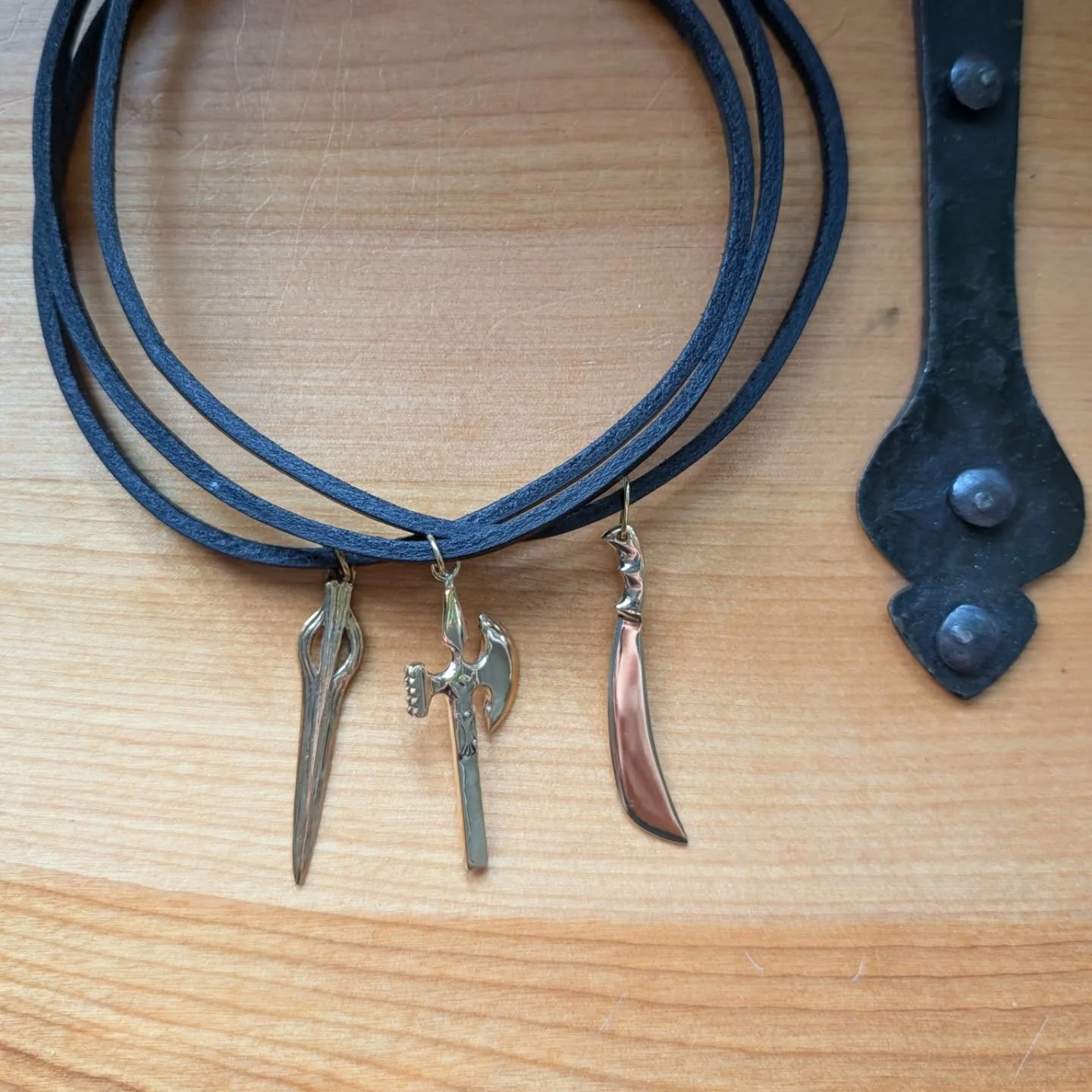 Very excited for these new weapon chokers I finished up. I just love the look of them. I think it really shows them off to advantage. #gothstyle #gothvibe #poleaxe #spearhead #weaponsjewelry