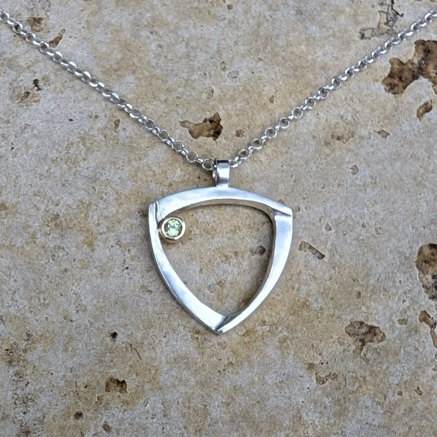 Recently sent off this version of my shield maiden gemstone pendant, set with a bright and sparkling peridot. Each shield maiden piece comes with a little note about its symbolism. For the powerful women in your life. #shieldmaiden #feminism #handmad