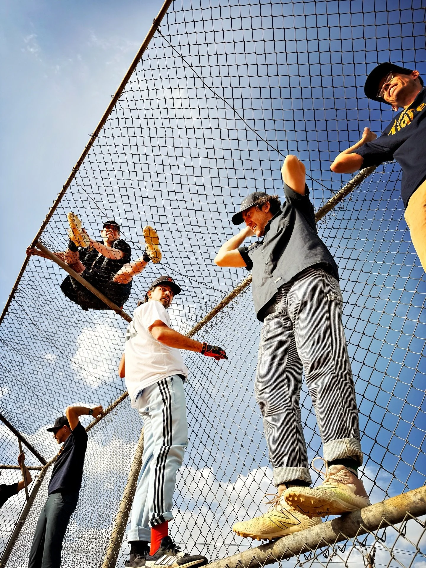 Between takes
Teammates openly wonder exactly what these team photos will end up looking like.