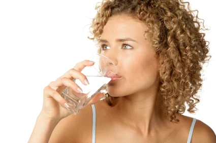 Lady drinking a glass of water.jpg