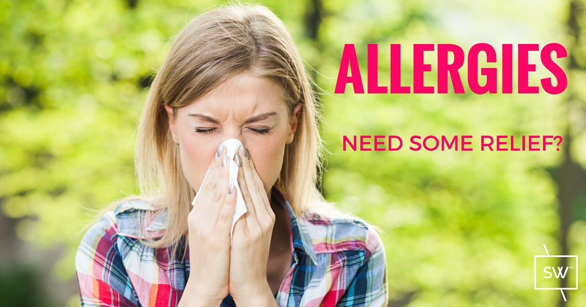 Photo: Lady blowing her nose because of seasonal allergies