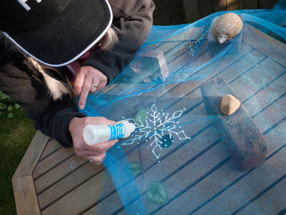 Apply snowflakes with Stickles, freehand or with a pattern.
