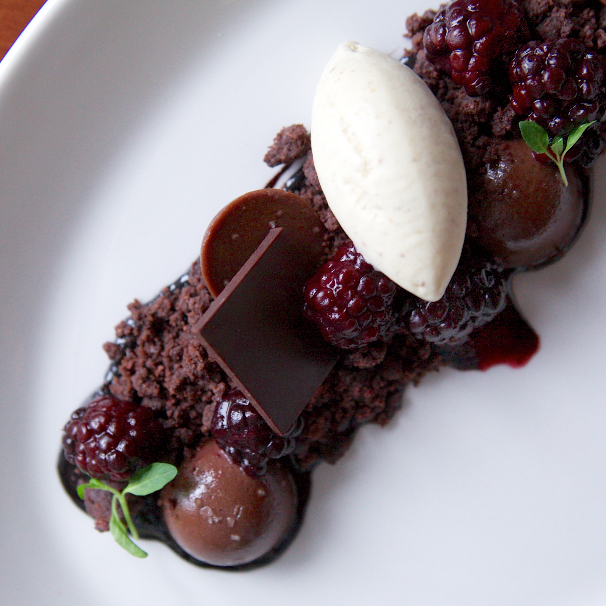 Above: Another decadent delight. Dark chocolate and milk chocolate truffles and ganache, devils food crumble, blackberry compote, vanilla bean sorbet.
