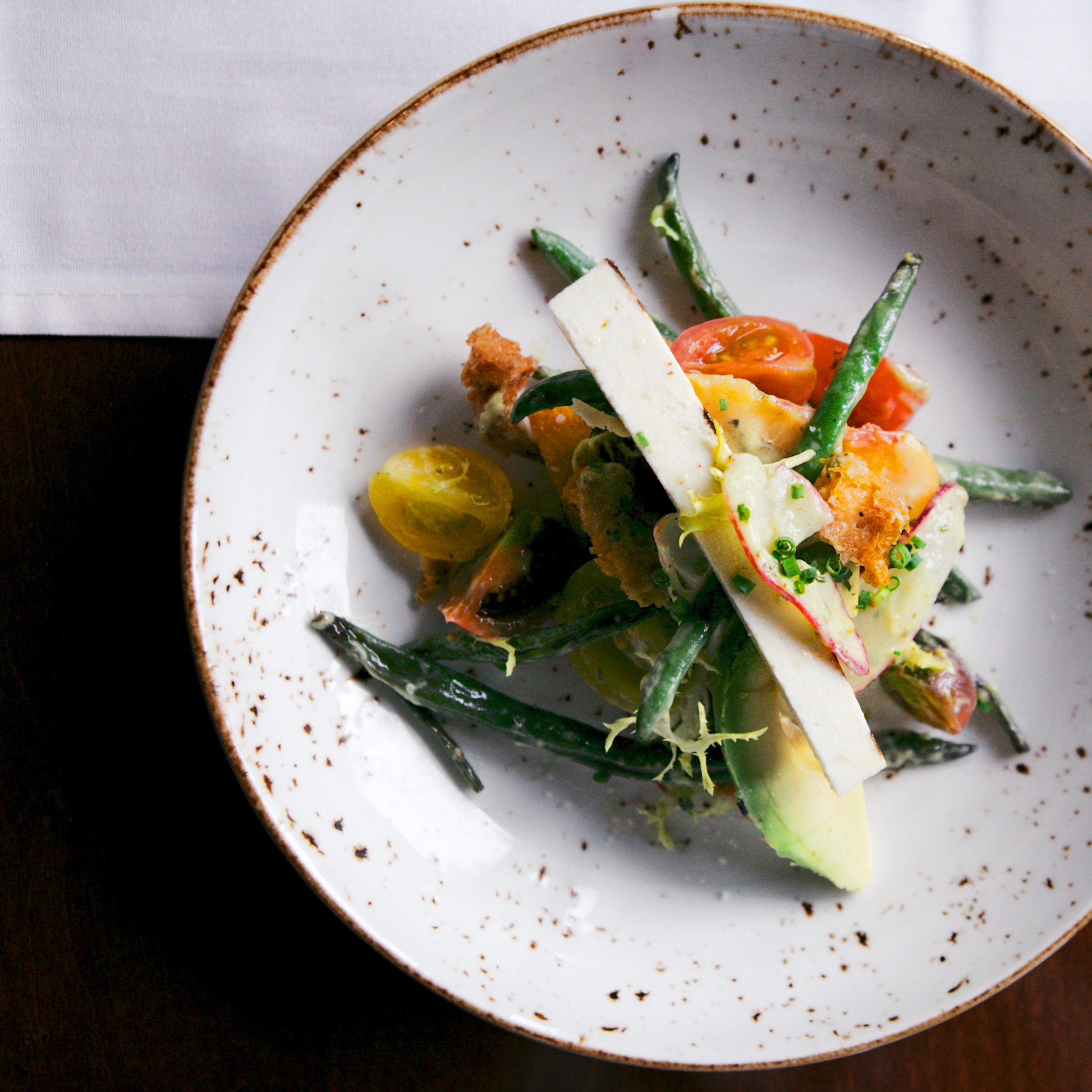 Above: green beans, cherry tomatoes, masumato peaches, avocado, green goddess yogurt, crunchy fried housemade brioche, shaved radishes, grilled ricotta salata.