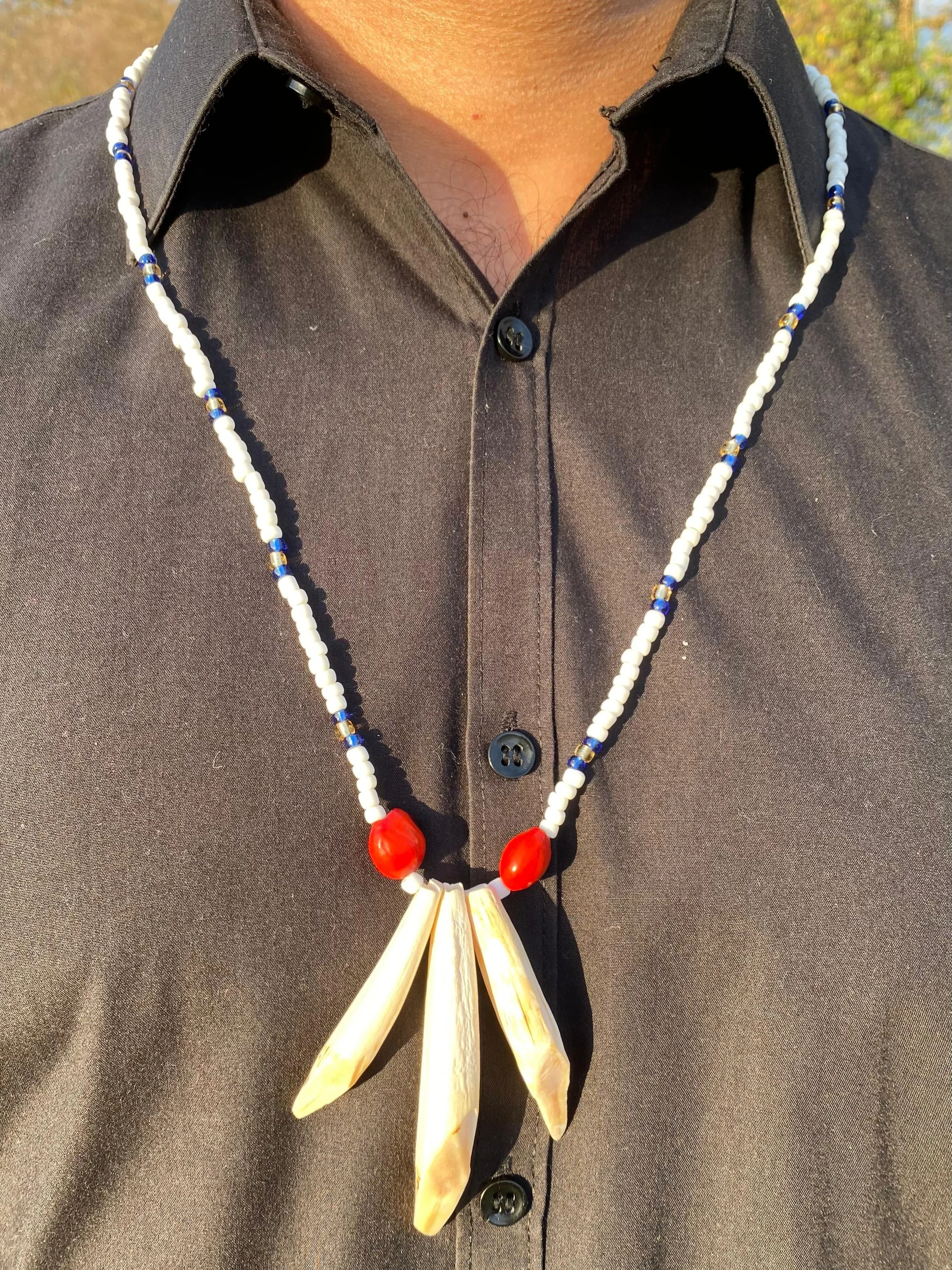 neckale £70triple teeth 2 seeds.jpeg