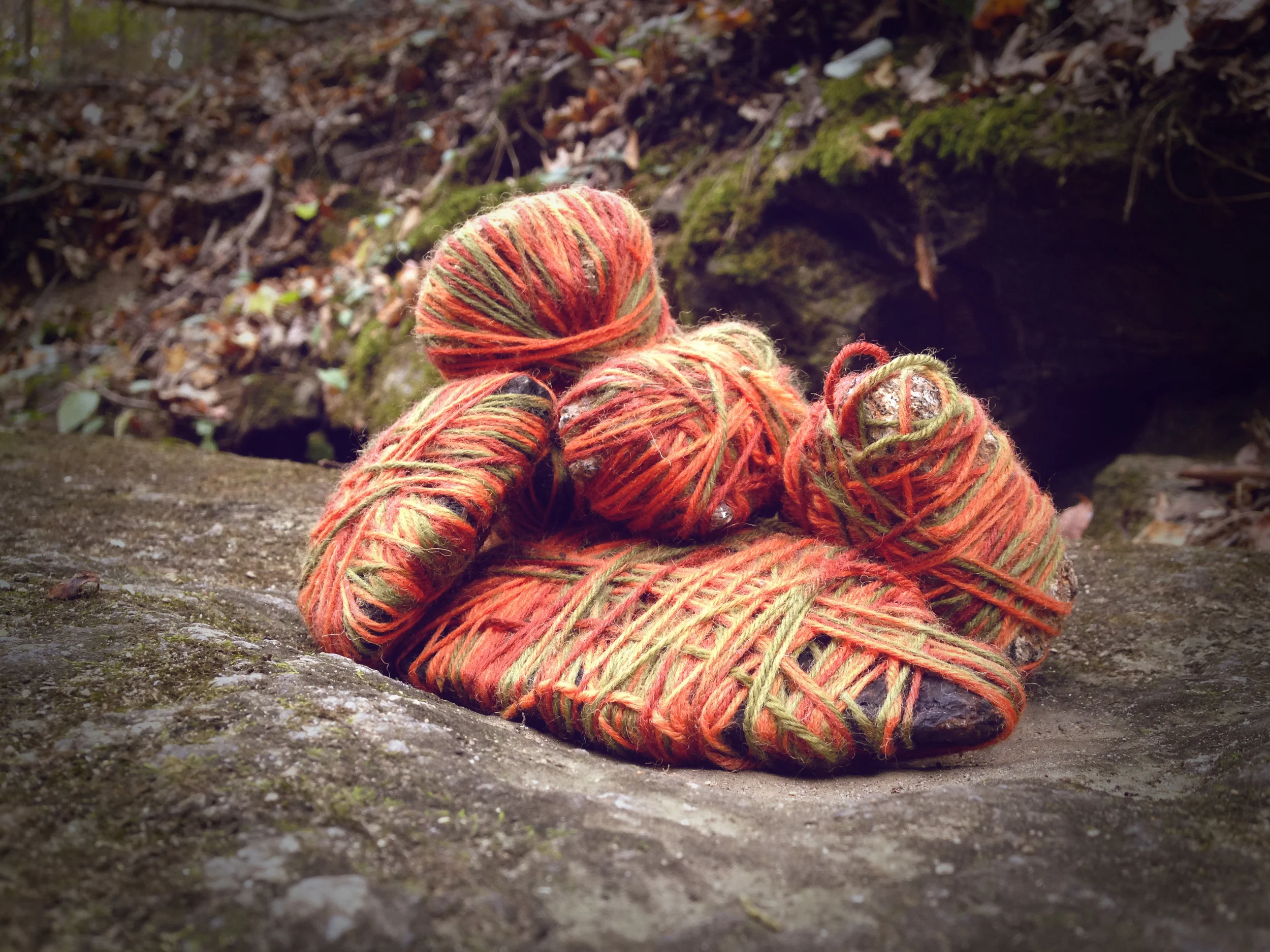 Stones wrapped in yarn on boulder. Athens, GA. Fall 2013. Instagram Filtered.