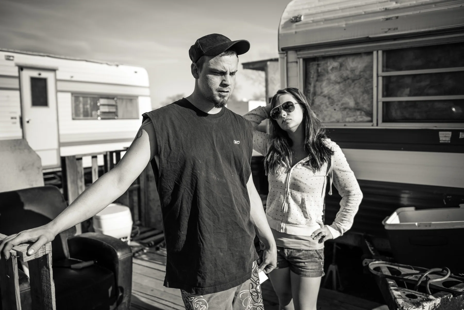 This worker and his girlfriend migrated from Montana to find work in bustling Williston. Together with her two children, they live in a small travel trailer in a muddy trailer park outside of town. 