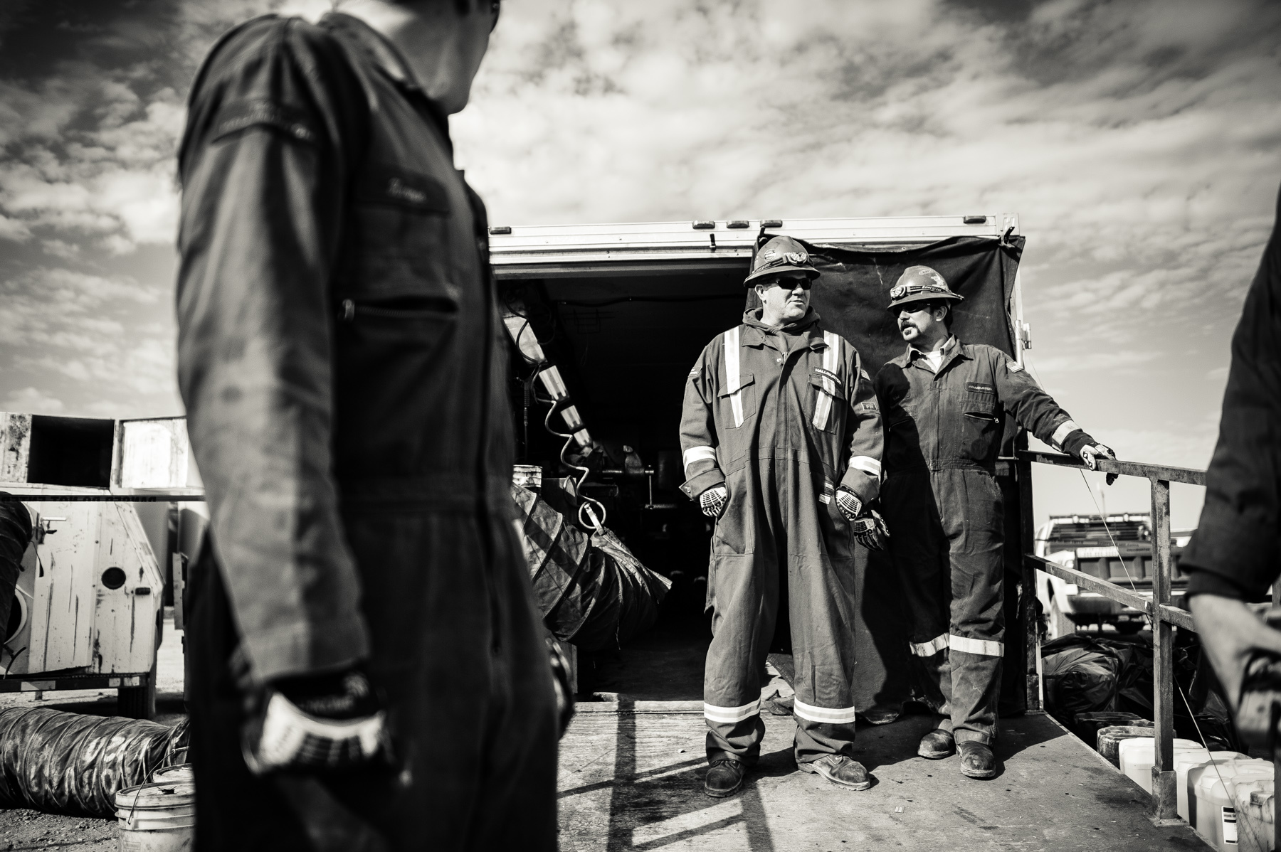  A wireline crew waiting for operations to commence. The wireline operators are responsible for inserting and setting off the shaped explosive charges that penetrate the drill pipe and surrounding rock thus allowing the high pressure water to radiate