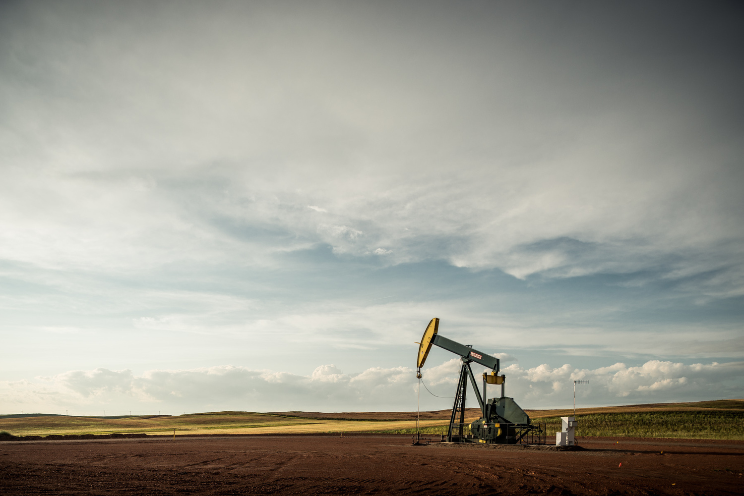  A Hess oil pump jack overlooks the North Dakota oil fields known as the Bakken in the aftermath of a thunderstorm. 