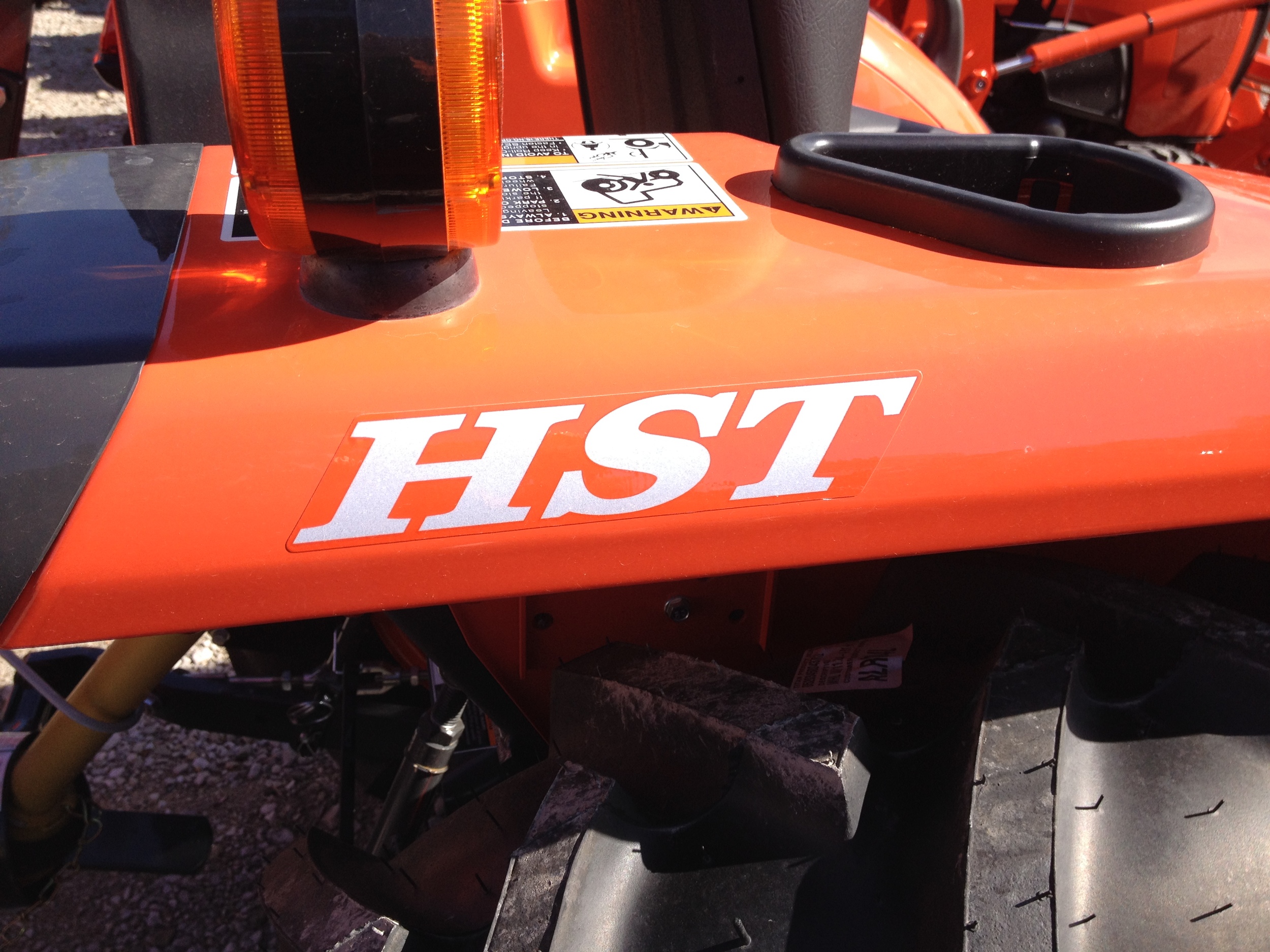 HST means the tractor has a hydrostatic transmission- a pedal for forward and reverse.