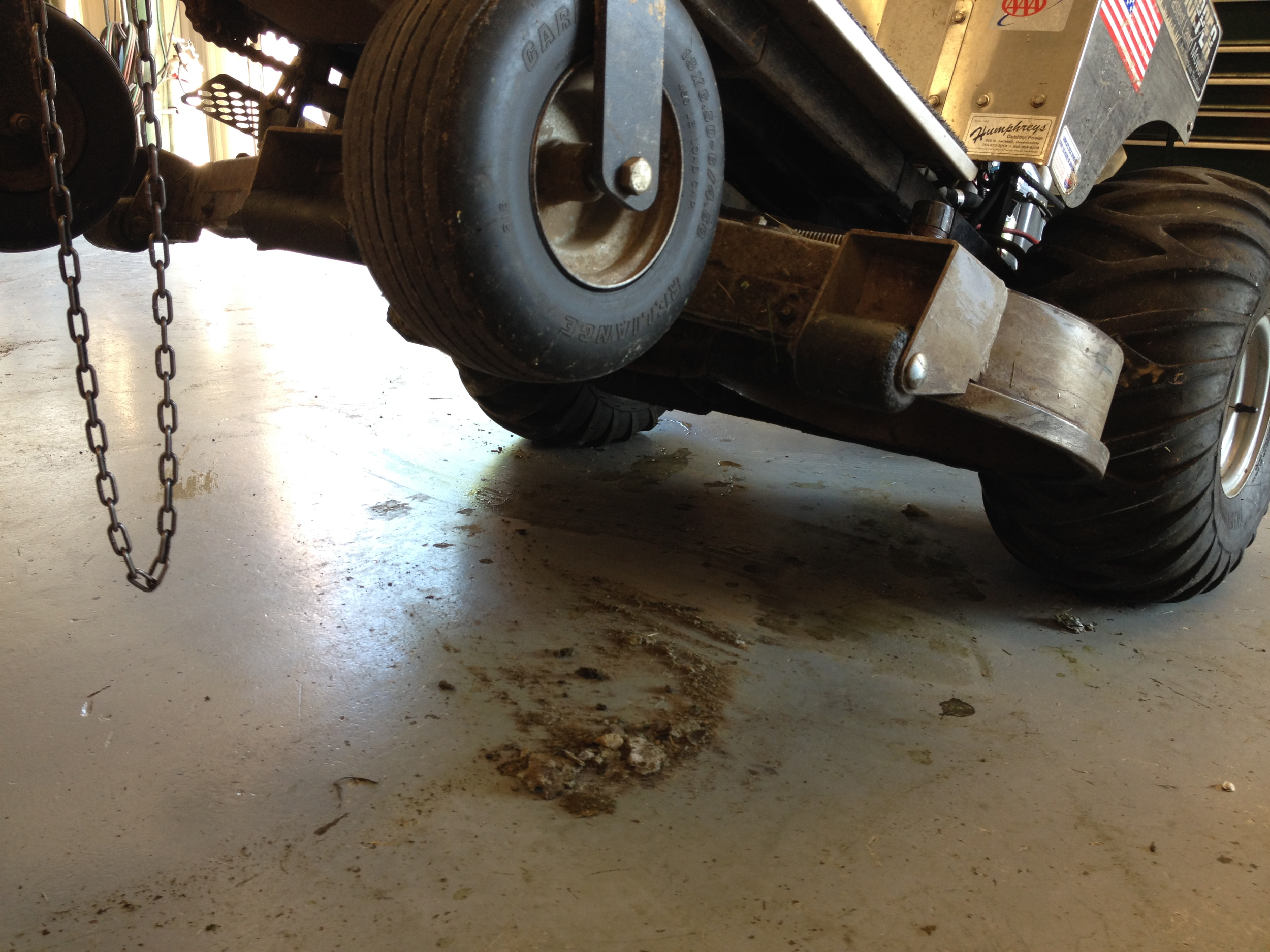 We use a chain hoist to lift zero turns off the ground but a standard floor jack can do just as well. 