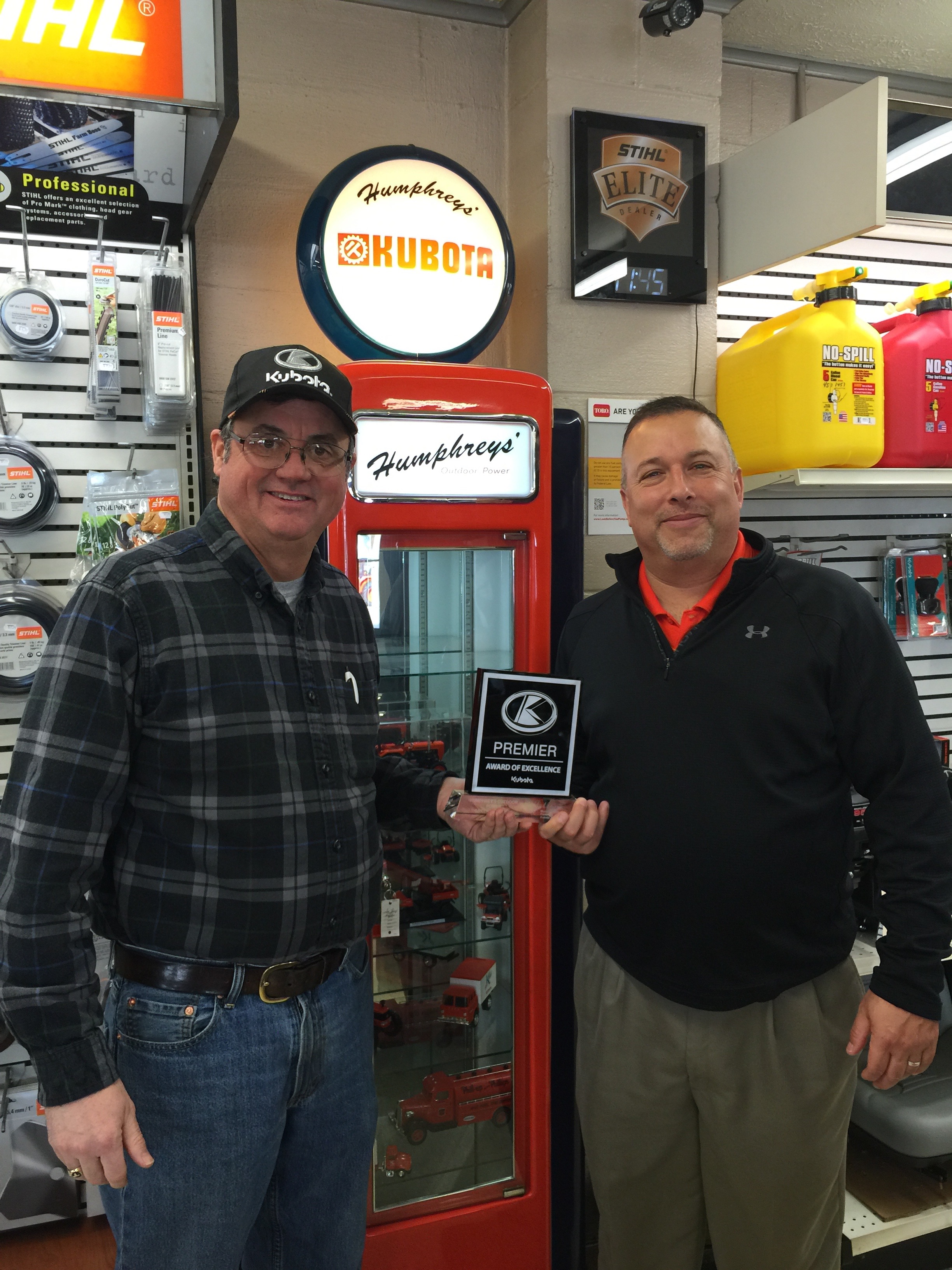 Brian Humphreys (Owner) of Humphreys' Outdoor Power Receives the Premier Award of Excellence from John Brookbank of Kubota