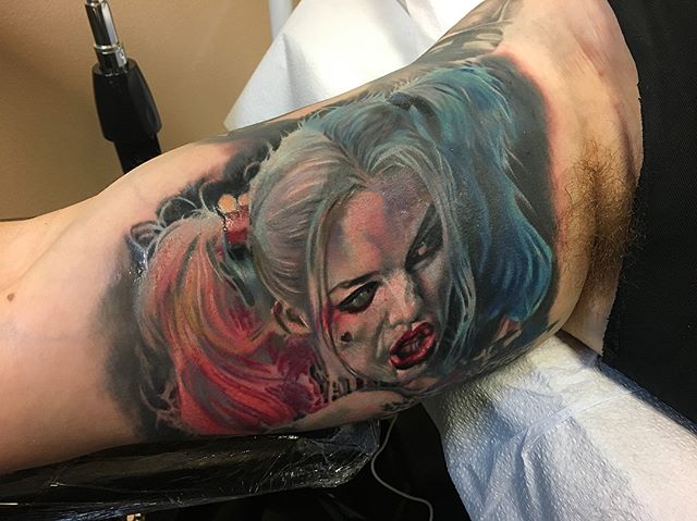 It was super difficult to get a good photo, but I'm STOKED on this #HarleyQuinn portrait I got a jump start on yesterday!! #margotrobbie #harleenquinzel #suicidesquad #batman #dccomics #supervillain #realism #realistictattoo #portrait #portraittattoo