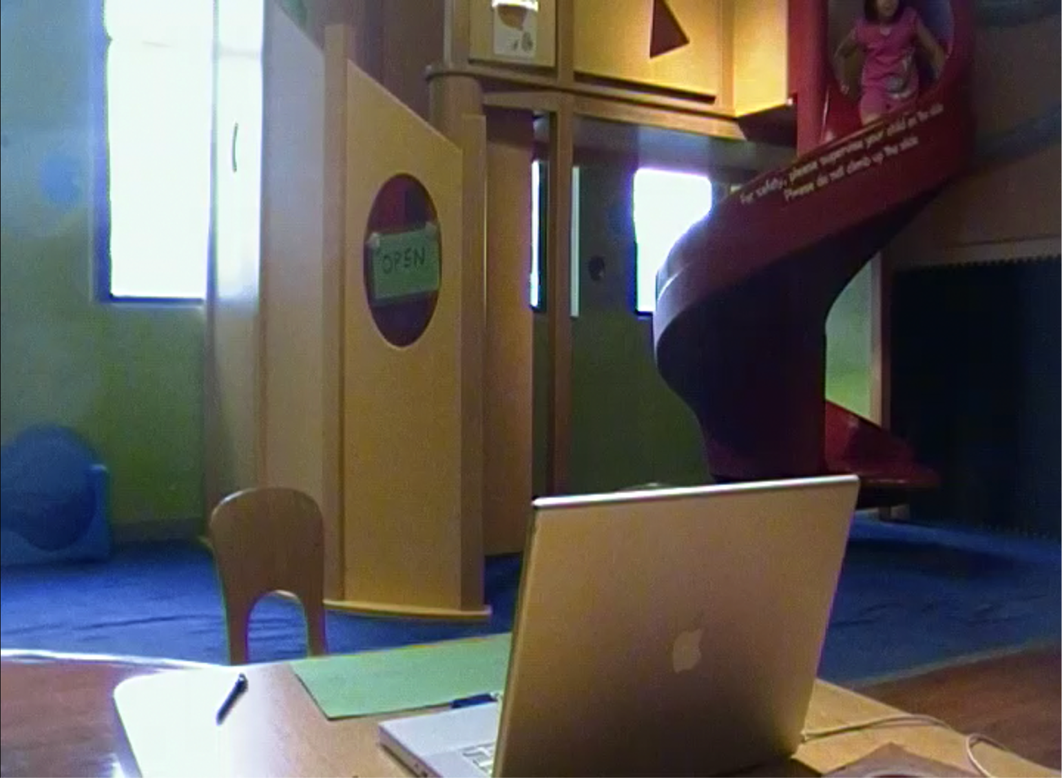 Setting of the altruistic punishment experiment. Children 3-6 must decide whether to close the slide (green sign) to stop a wrongdoer from going down. 