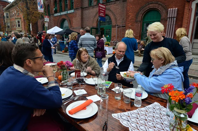 About 200 people gather in the middle of Beaver Street in York for the Farm to City Street Dinner featuring food freshly harvested from local farms, Sunday October 4, 2015. John A. Pavoncello - jpavoncello@yorkdispatch.com