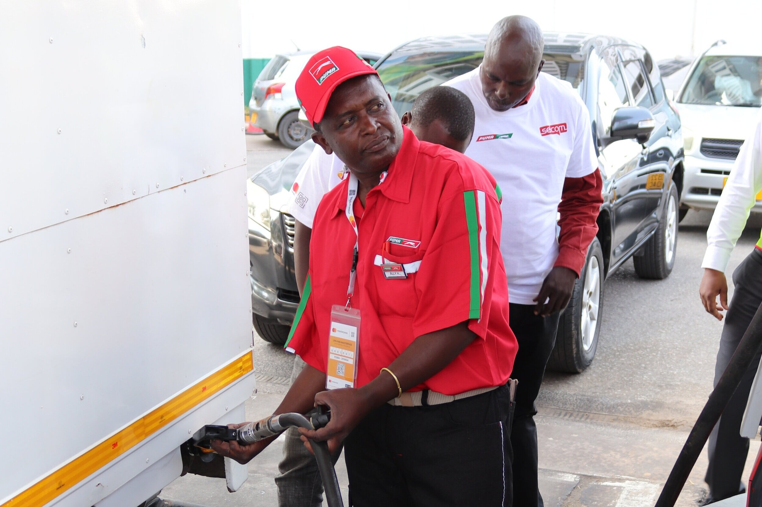 Mr Washington Oyamo, Full Tenki reward recipient watches on as his car gets fuelled at Puma Upanga filling station.