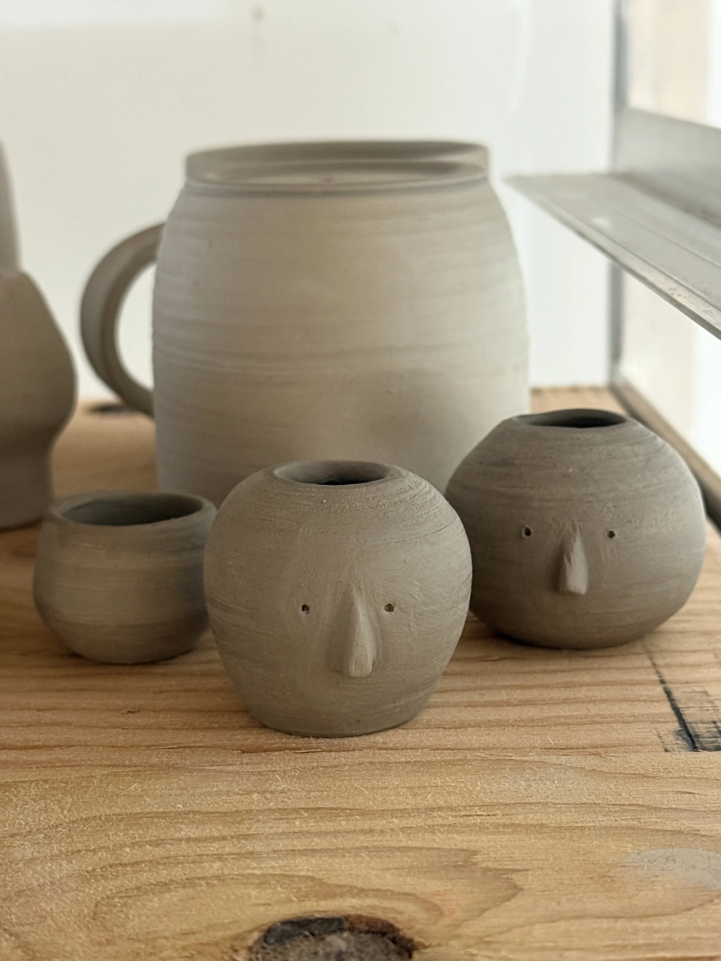 Eric vases waiting for bisque firing.