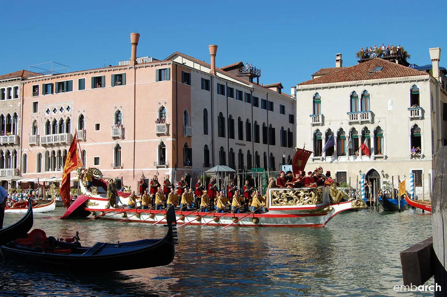 Colorful boats on the Grand Canal during the Regata Storica di Venezia.