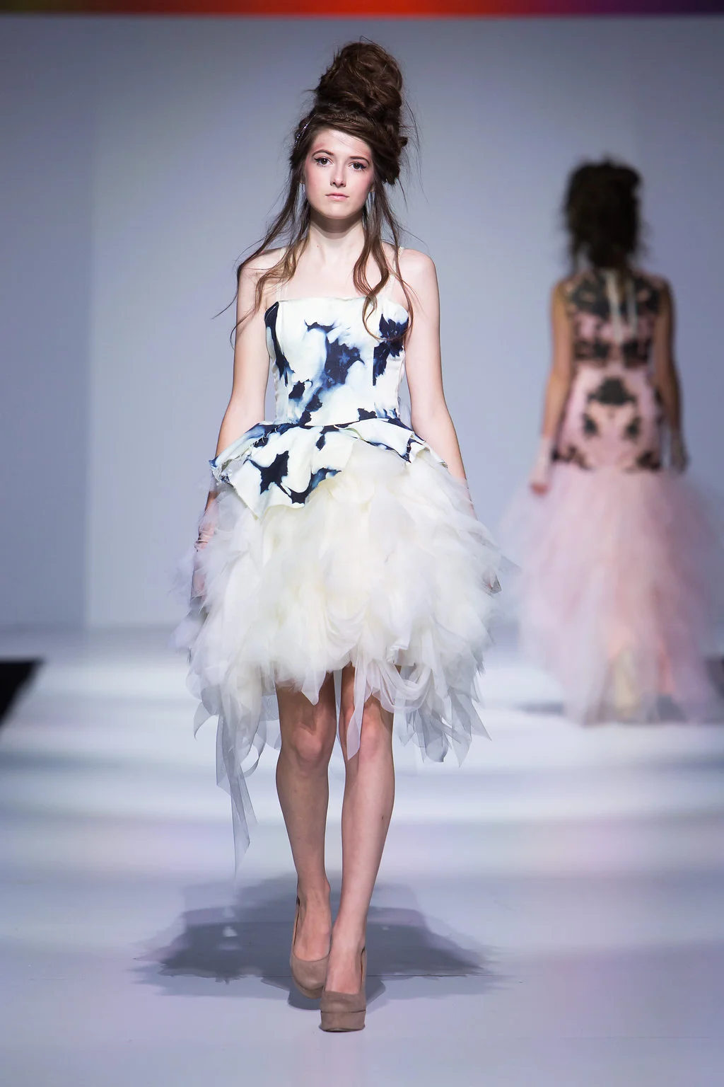 'cloud' bleached denim, with peplum over a tattered tulle and netting skirt