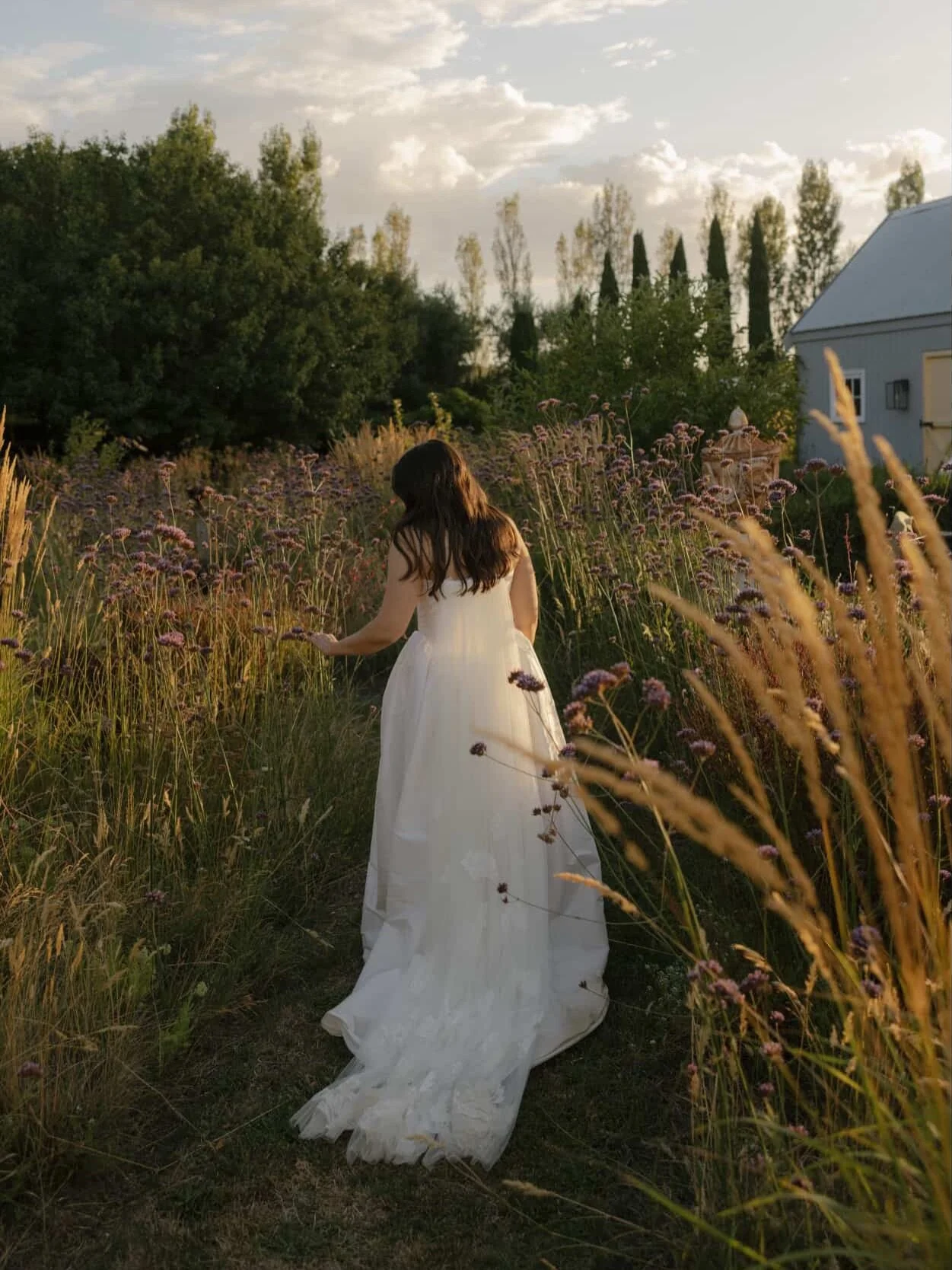 Hints of summer from our beautiful Australian bride Nicole, who married her love last month at home in Melbourne 🤍

She wore a custom Delphine gown, complete with a soft tulle &amp; lace-appliqu&eacute;d train and her vintage Manolos ❣️

We loved cr