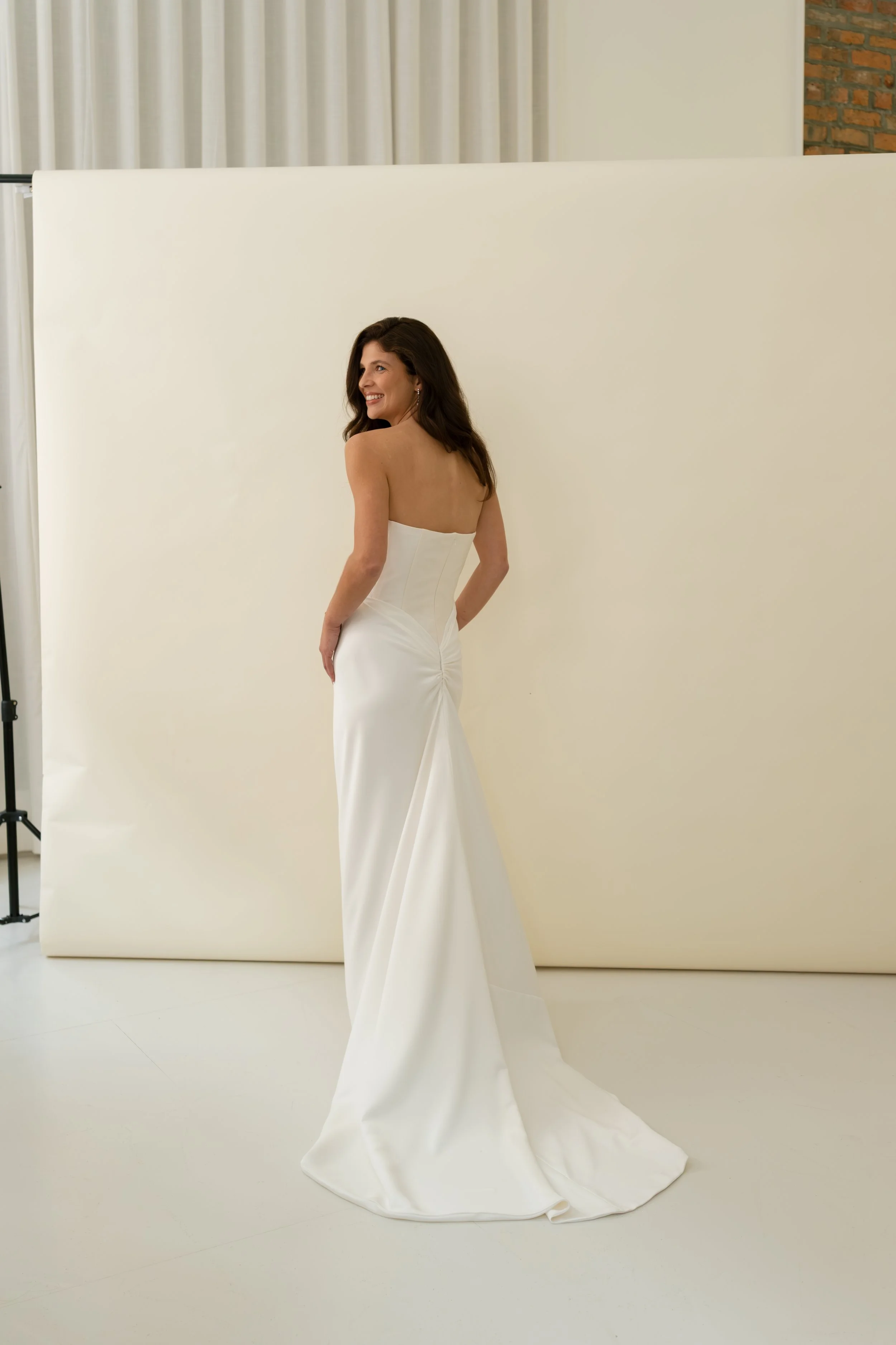 Tali dress by Jessica Bennett corset bodice with draped bias cut satin skirt and lace trim modern romantic bridal look