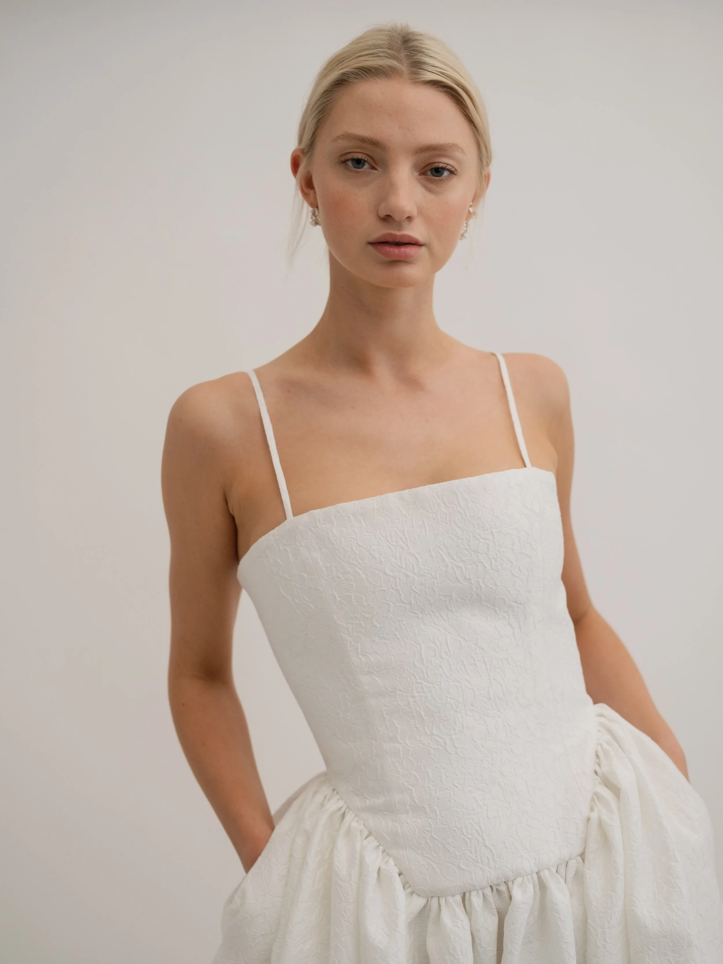 Delphine wedding dress by Jessica Bennett brocade structured dropped waist bodice with full length skirt and train crafted from a luxurious brocade fabric 