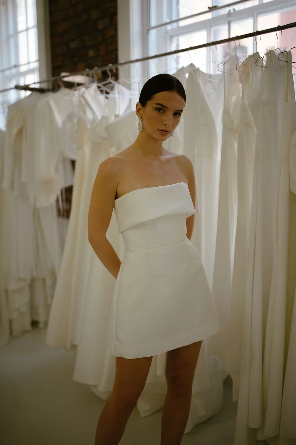 The Alexa Mini is a structured Mikado mini dress that blends timeless tailoring with playful modernity. Featuring a supportive boned internal bodice, a clean bias band neckline and a softly flared A-line mini skirt, Alexa offers a contemporary interp