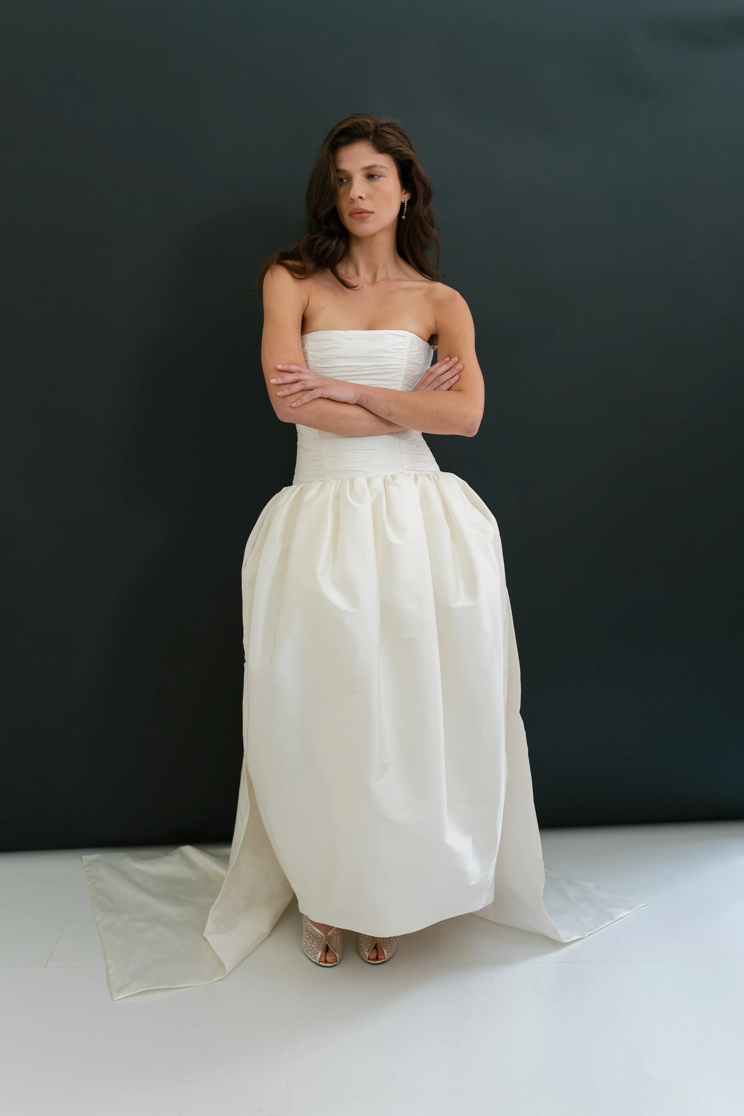 A chic removeable bridal separate, that allows for a dramatic optional train on  our Sloane dress and Cecile dress. Gathered taffeta and internal tulle give a voluminous train that fastens on to the back waist of gowns with hook and loop fastenings. 
