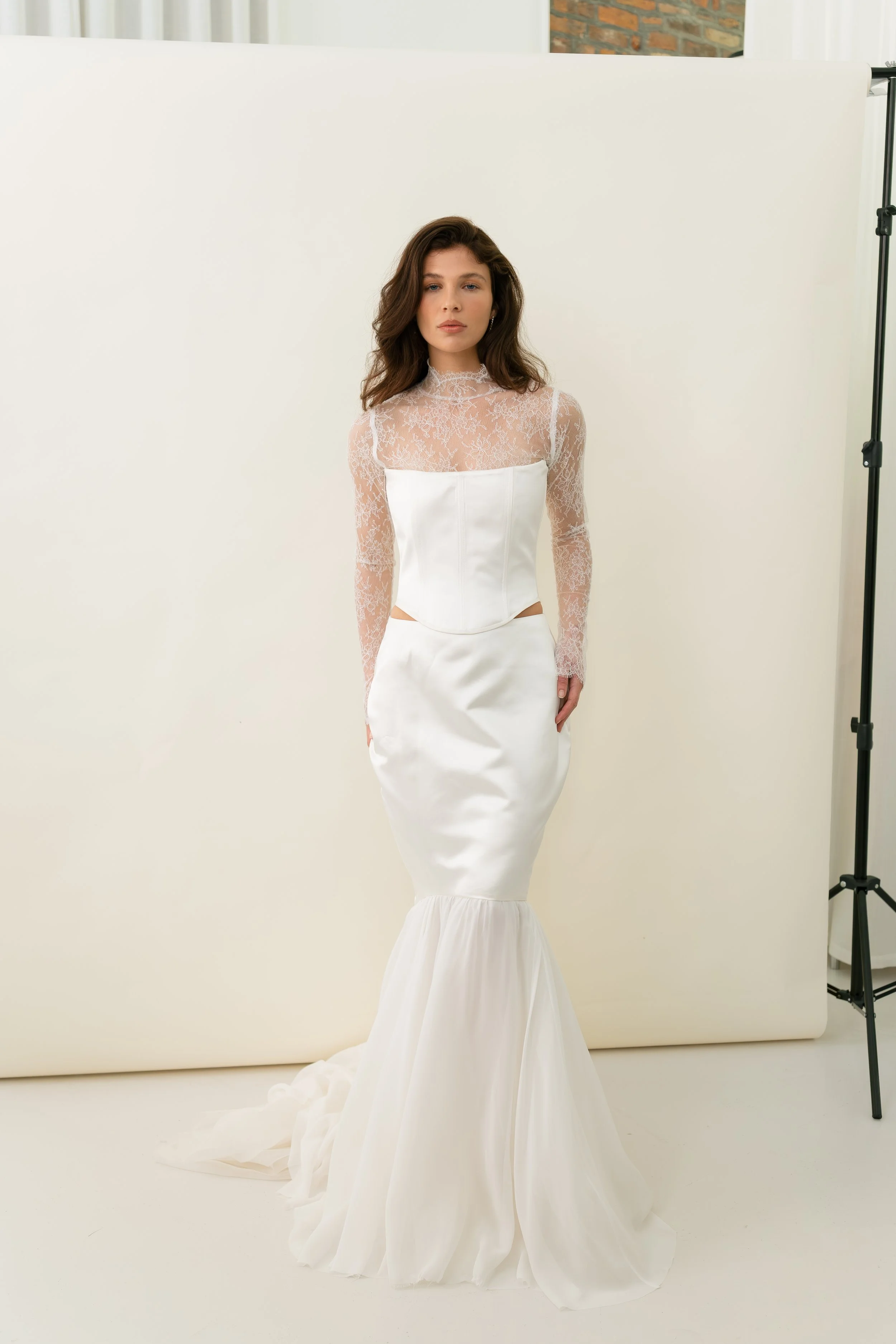 Meg lace top by Jessica Bennett cut in delicate chantilly lace with high neck, fluted sleeve and button fastening