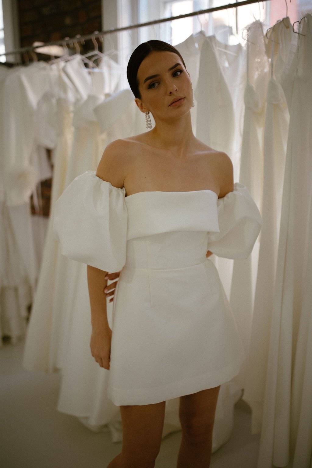 The Alexa Mini is a structured Mikado mini dress that blends timeless tailoring with playful modernity. Featuring a supportive boned internal bodice, a clean bias band neckline and a softly flared A-line mini skirt, Alexa offers a contemporary interp