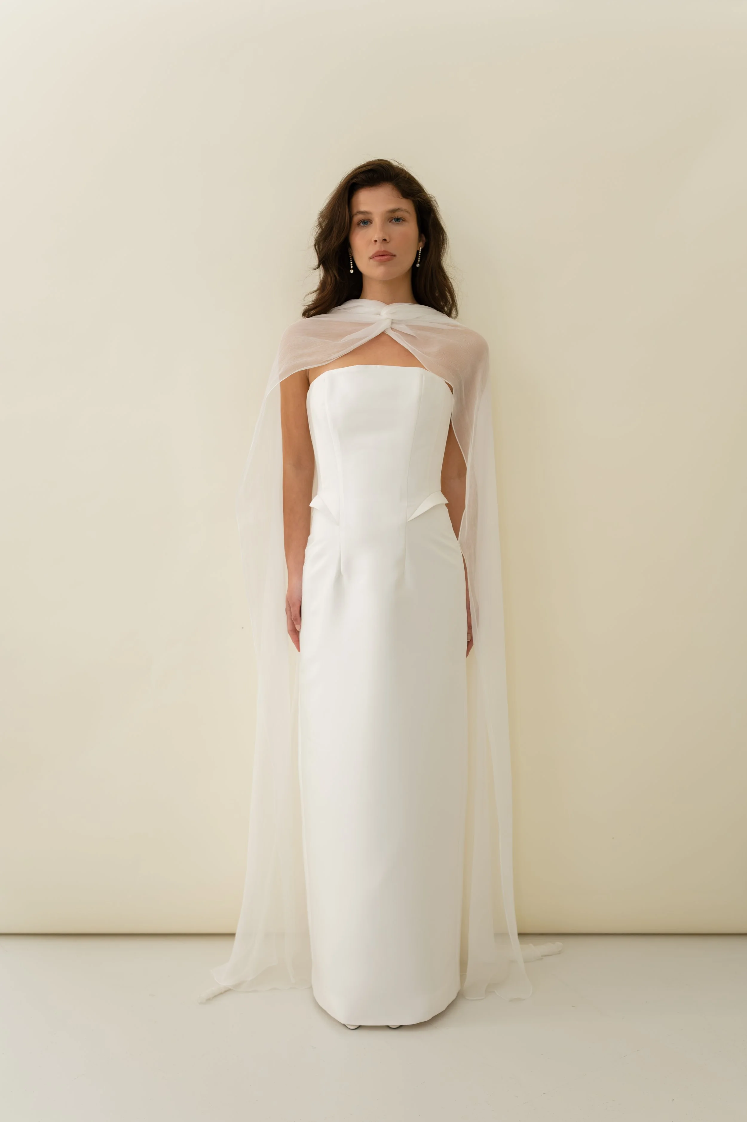 Demi dress by Jessica Bennett, column cut mikado dress with boned panelled bodice and hip detailing. Worn with Demi cape