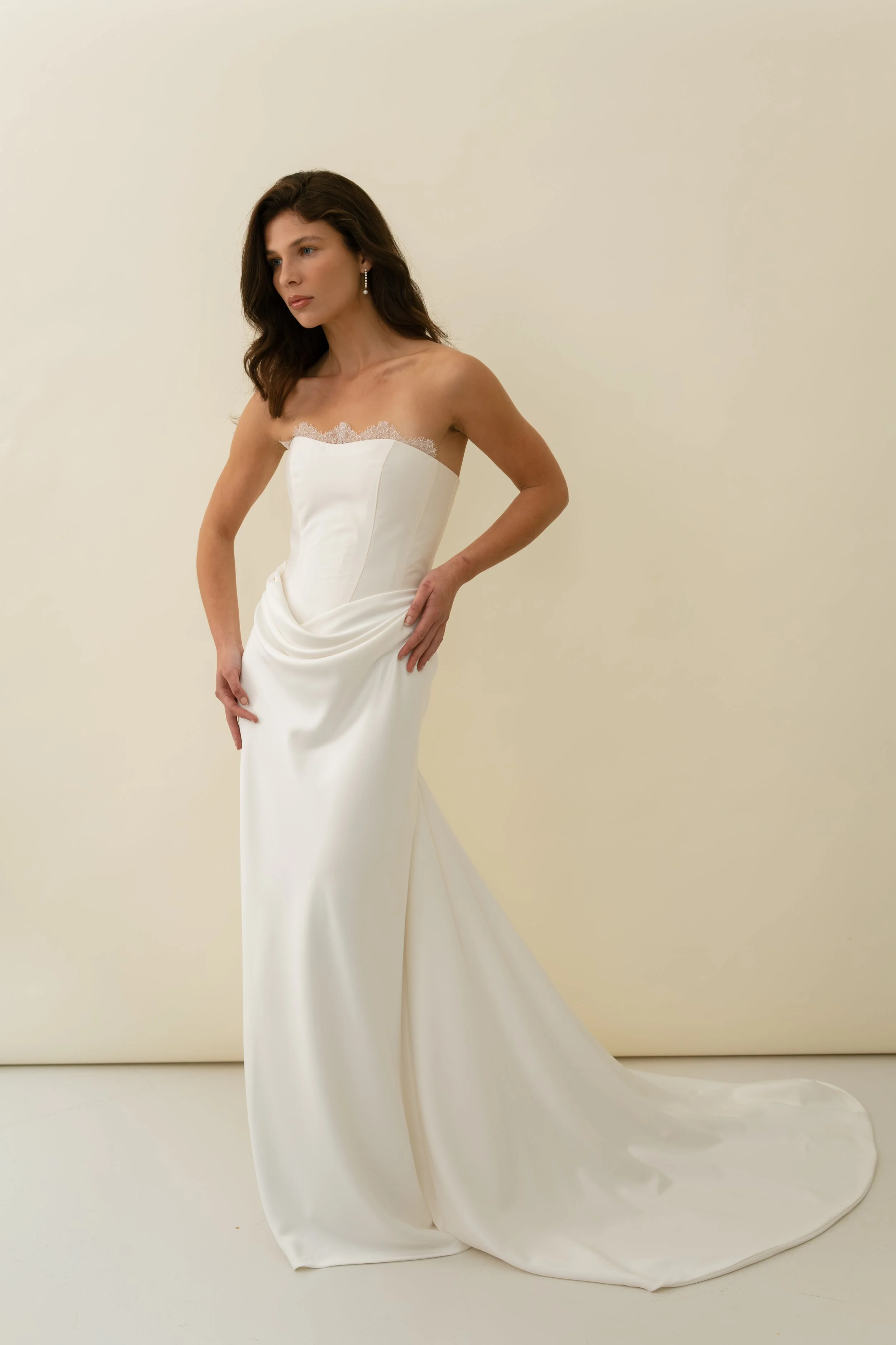 Tali Dress by Jessica Bennett, a corseted bodice meets a draped bias cut skirt