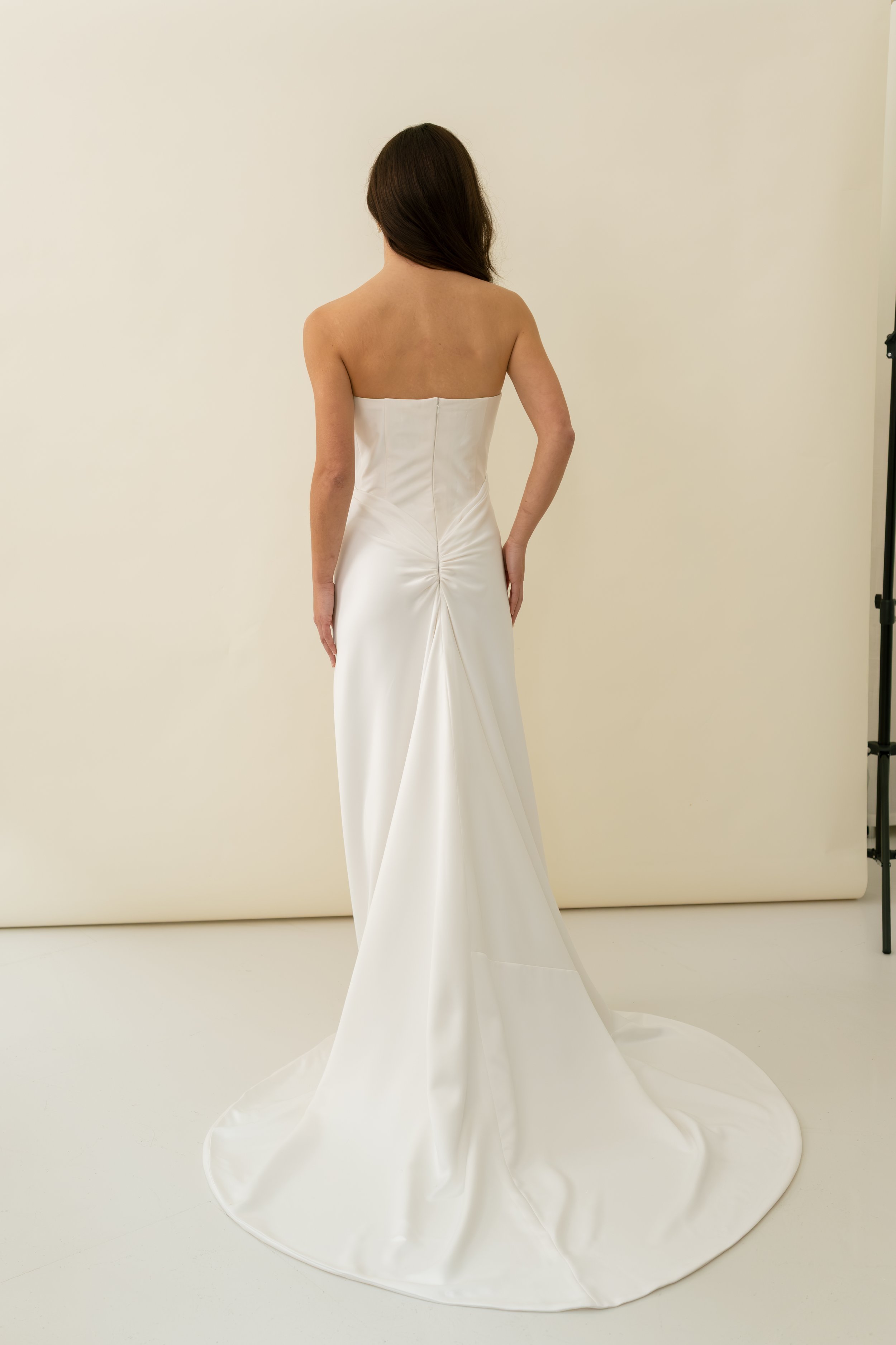 Tali dress by Jessica Bennett corset bodice with draped bias cut satin skirt and lace trim modern romantic bridal look