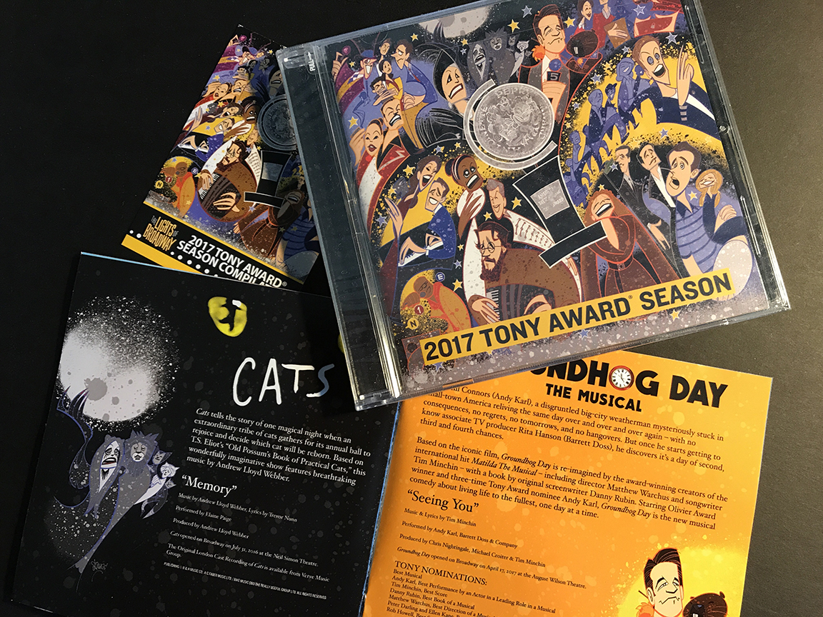 The CD, booklet, and limited edition trading card.