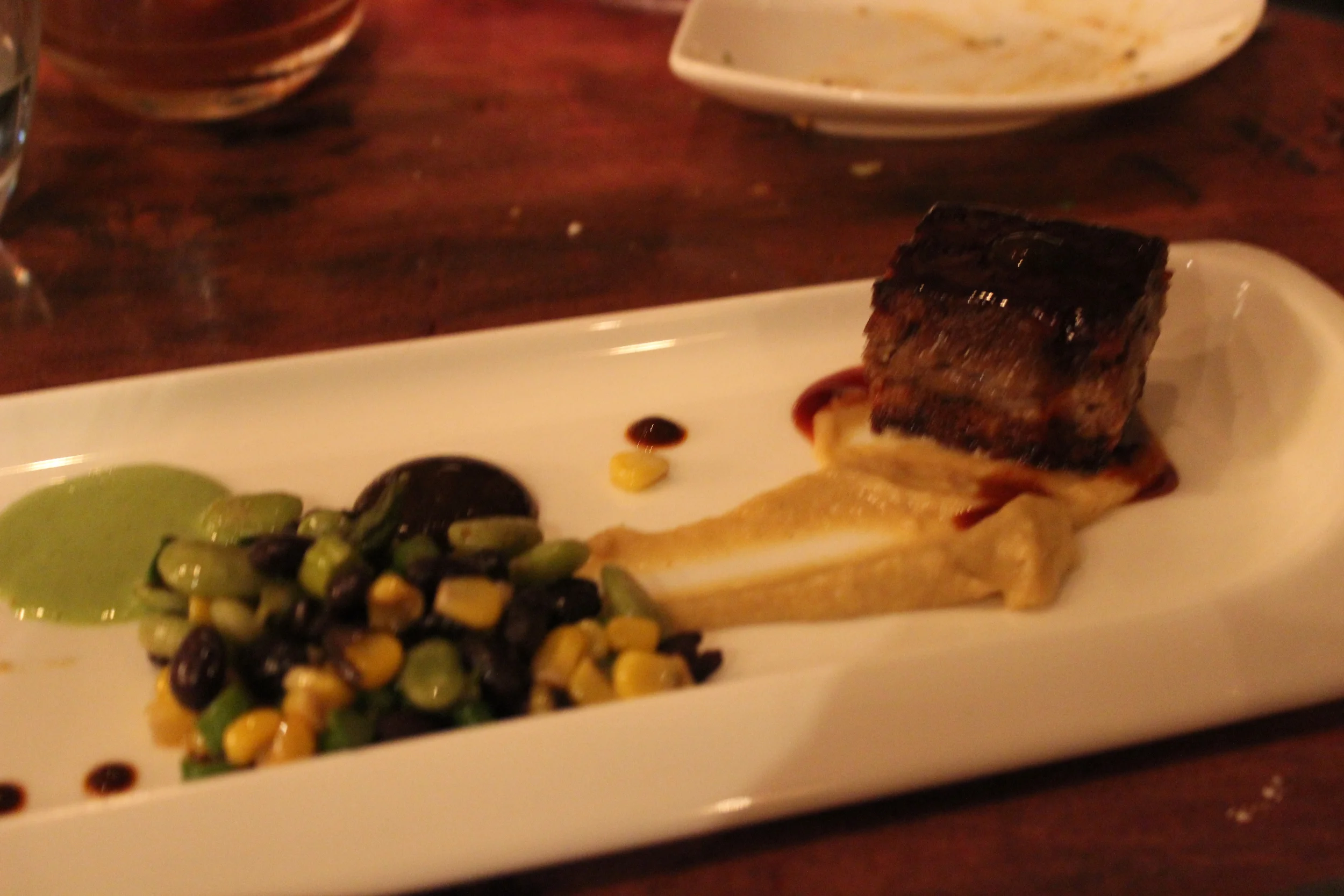Course 10: Carnitas of Pork Belly & Cheeks, Fava Beans, Black Trumpets, Pasilla-Pulque-Prune