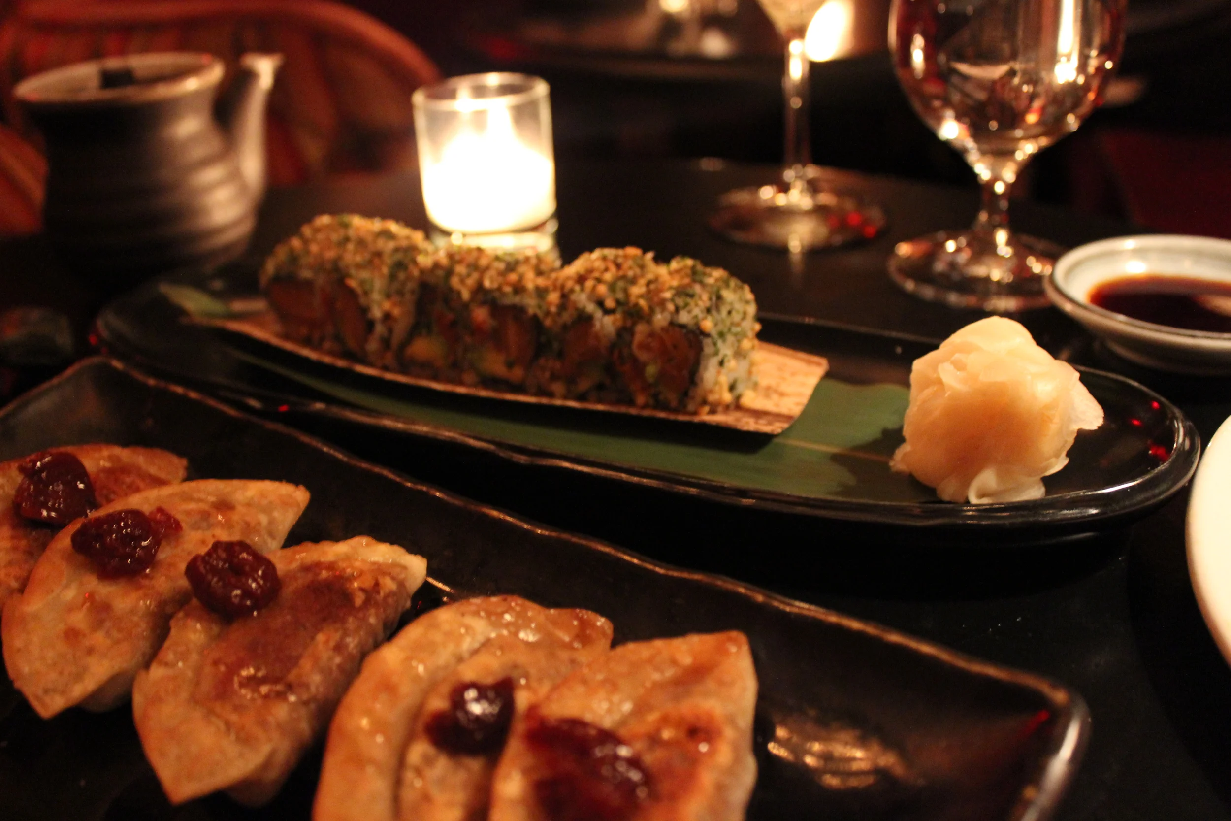 Foie Gras Shortrib Gyoza (front left) and Salmon Avocado Roll (back right)