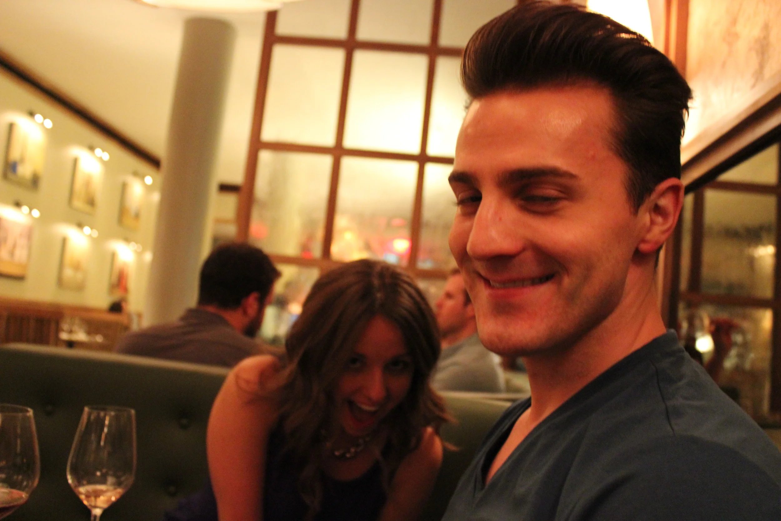 A candid of Courtney and Tim being silly!