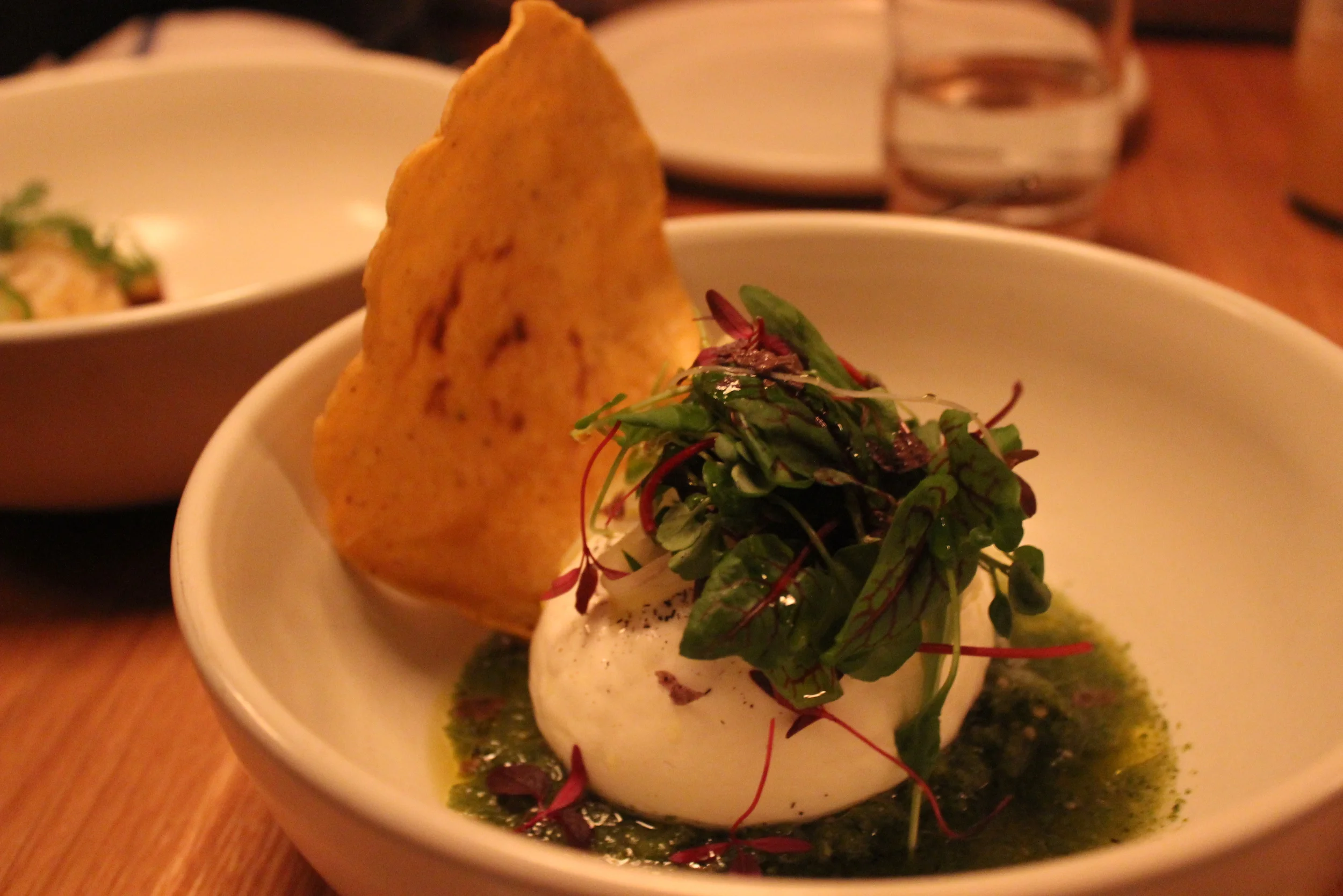 Burrata, salsa verde, weeds 