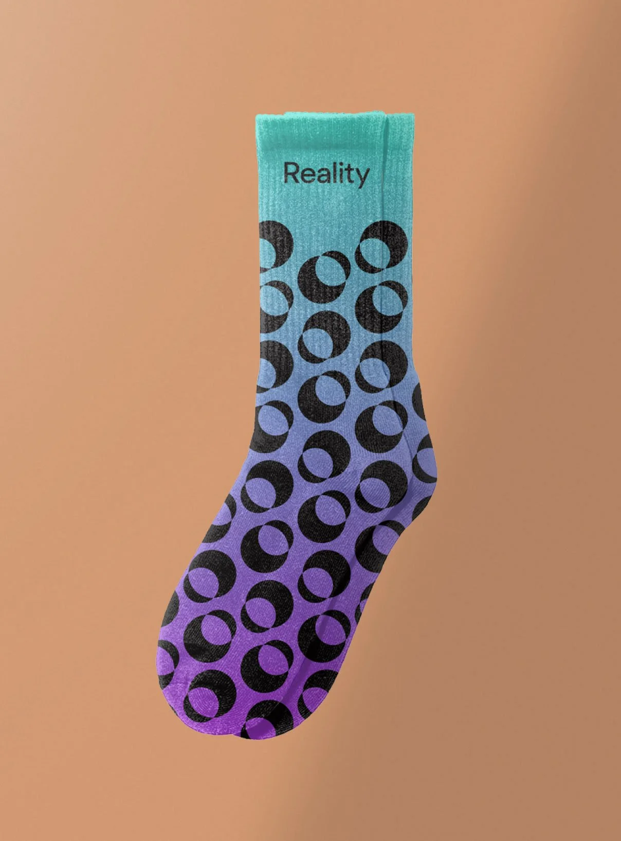 Custom promotional knit merchandise mockup showing branded socks featuring the Reality logo.