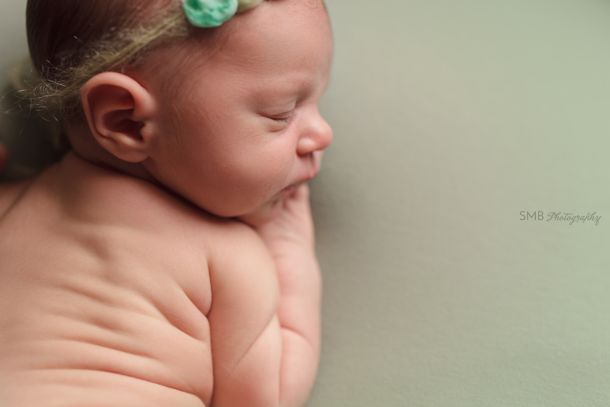 Newborn girl back rolls