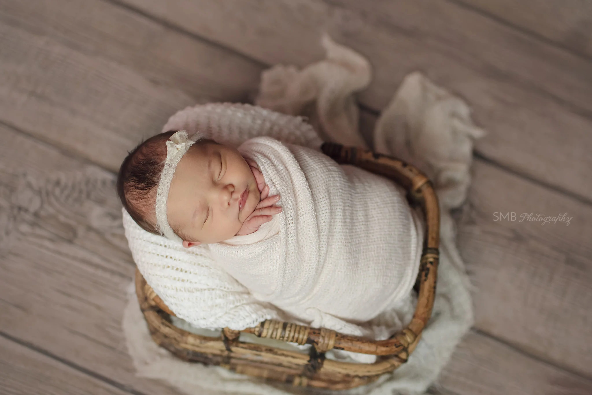 New baby girl wrapped in basket
