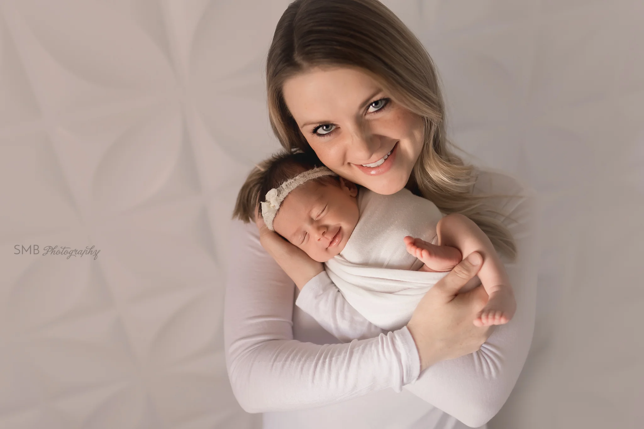 Mom holding baby girl