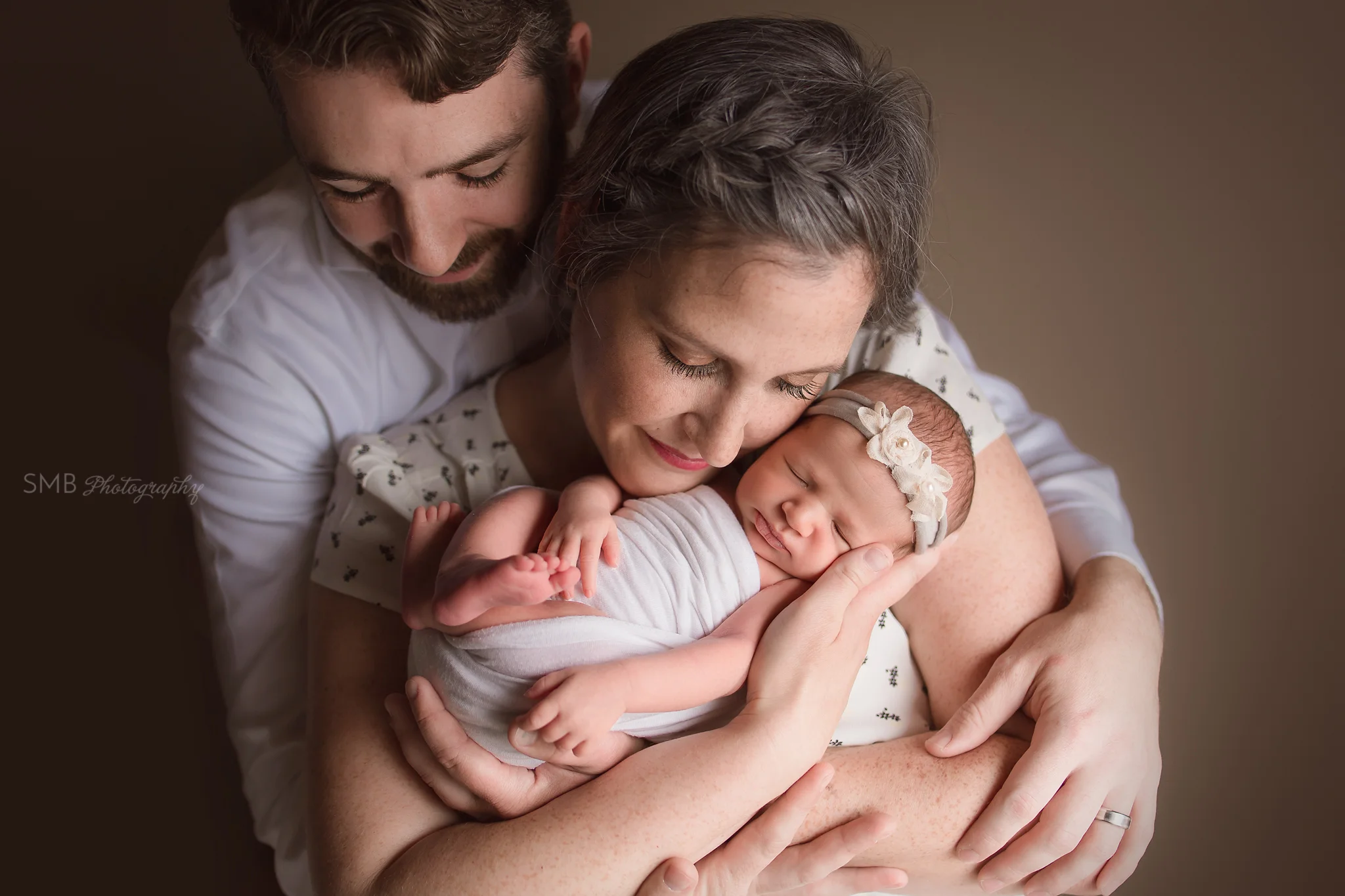 New baby girl safe in Mama's arms