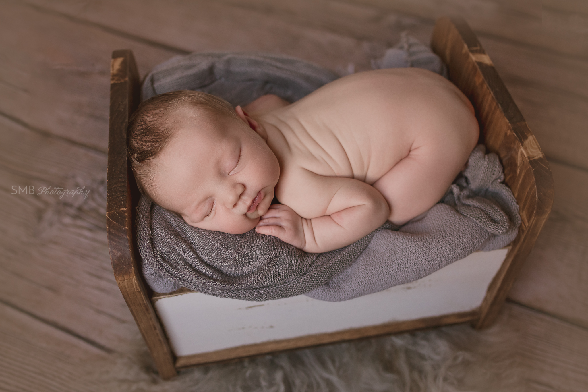 Baby boy sleeping in bed