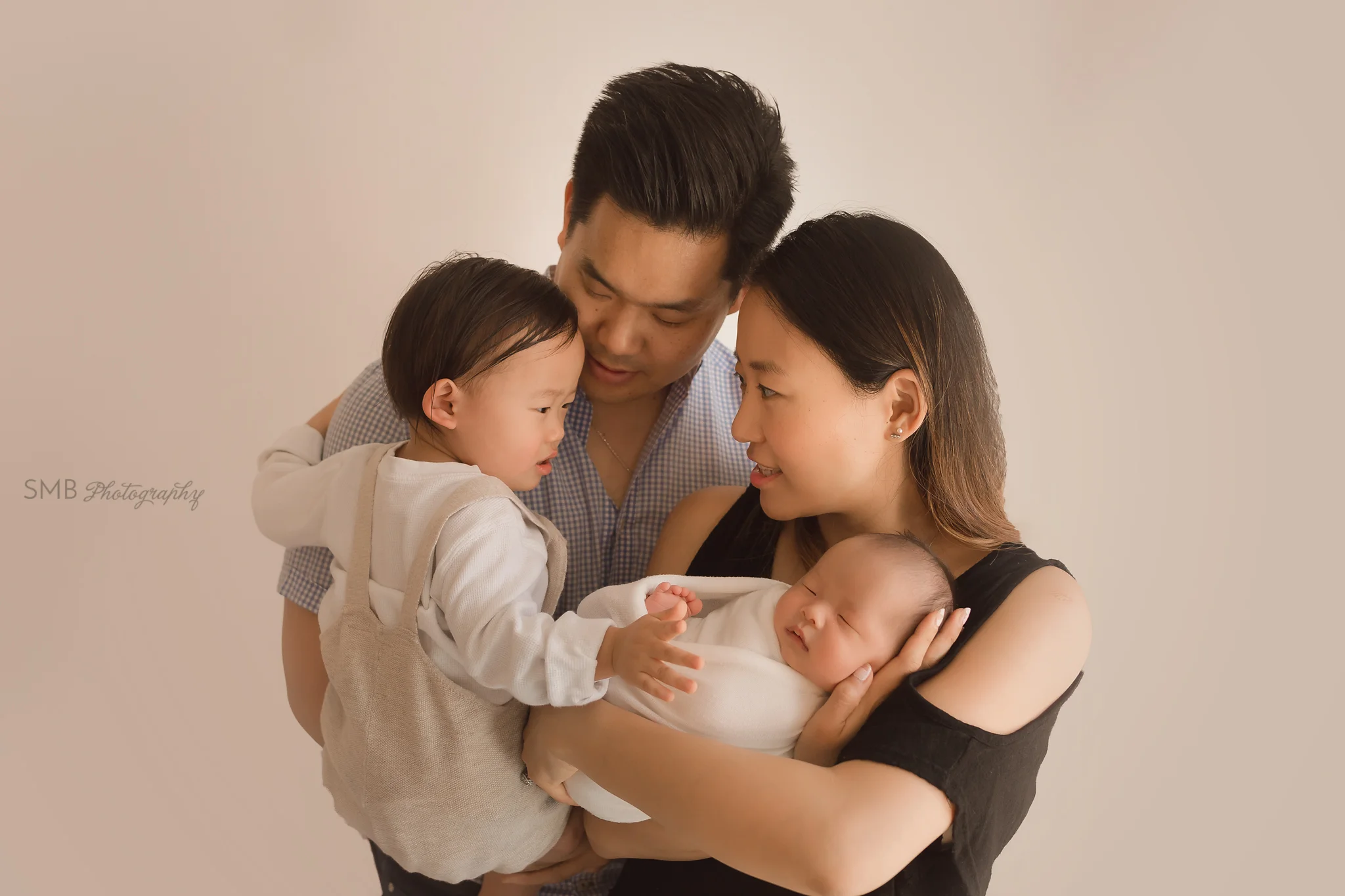 Mom, Dad, big Brother and newborn son