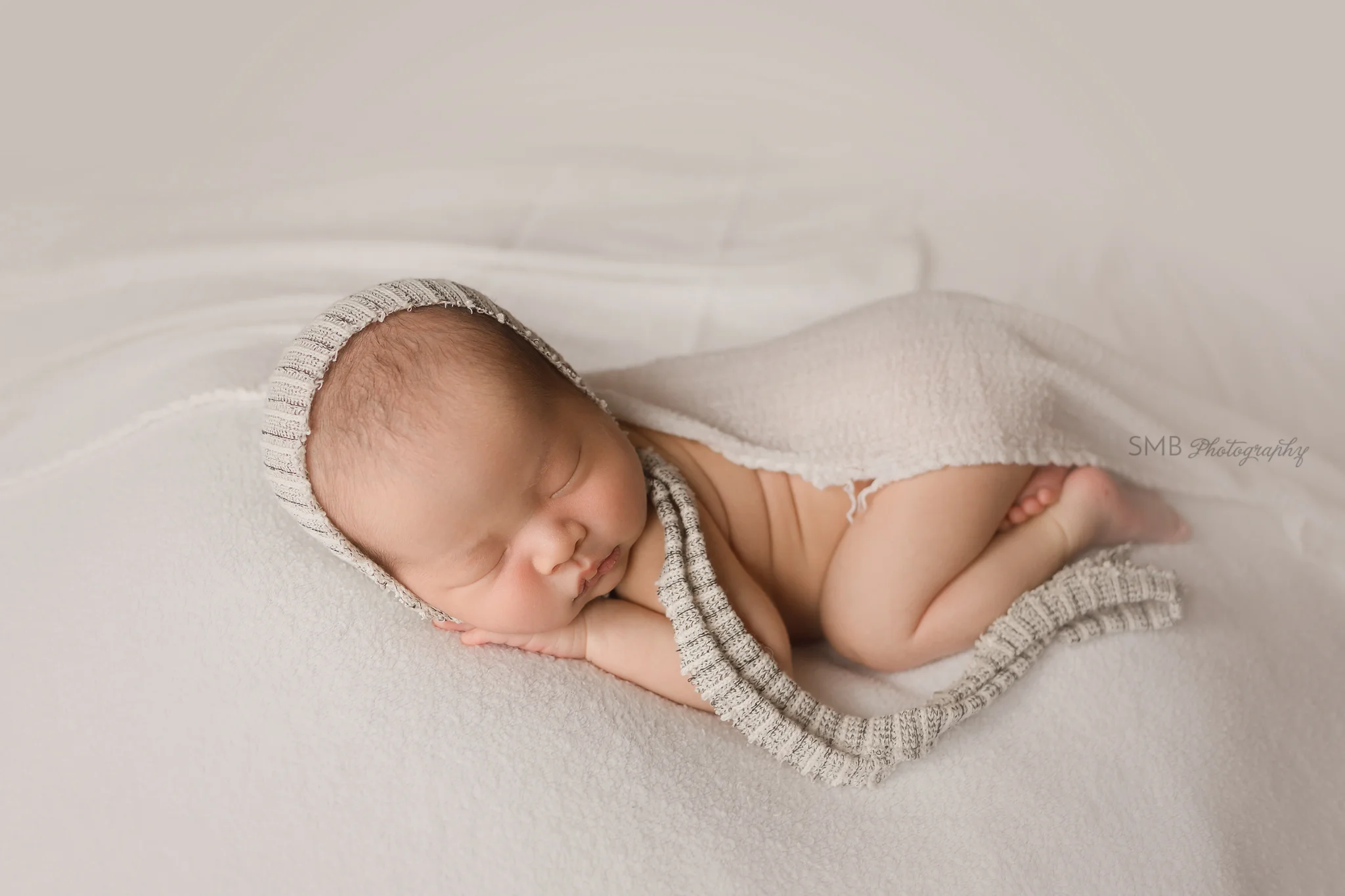 Newborn sleeping under wrap