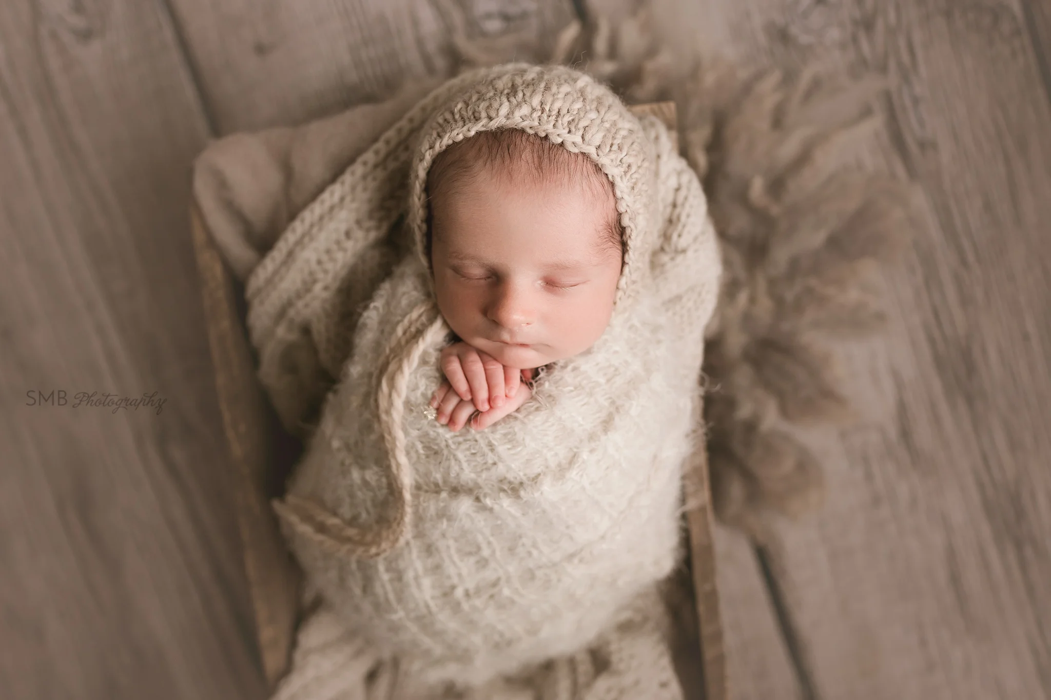 Baby boy wrapped up in beige