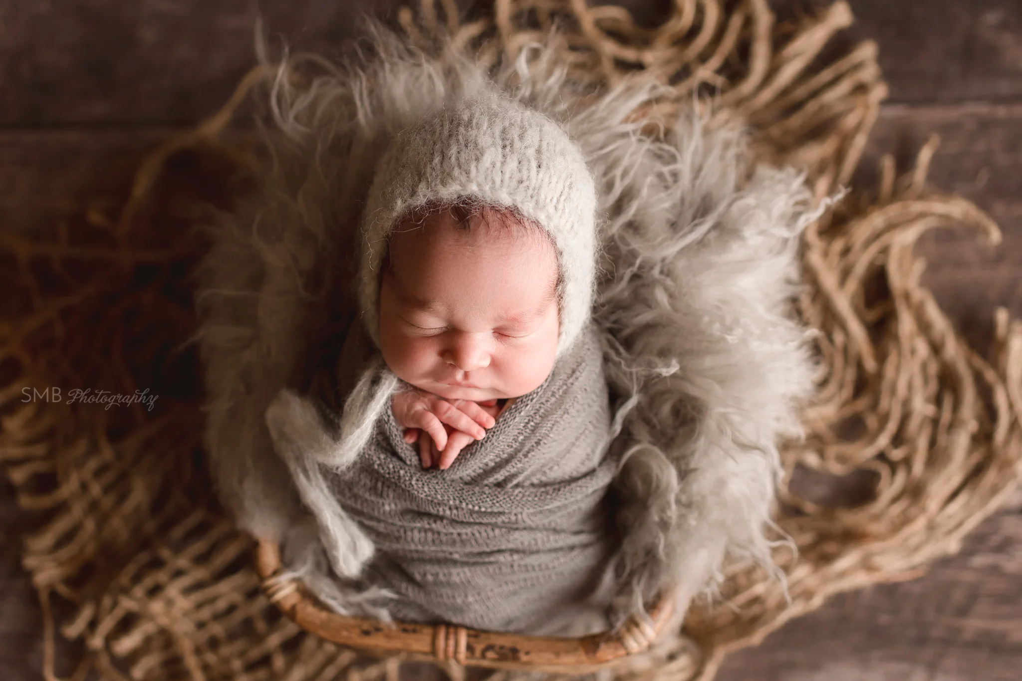 Baby boy in bamboo basket